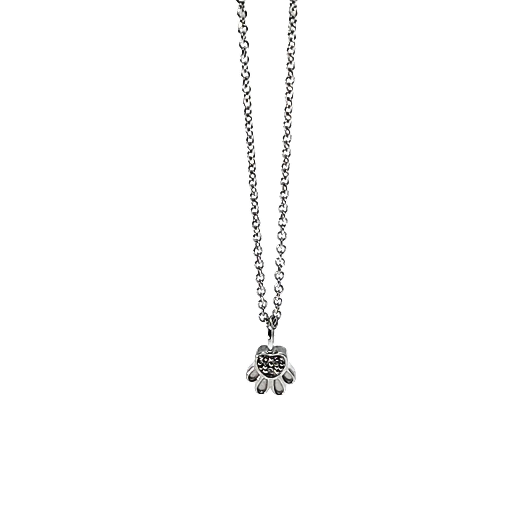 Companion mini Paw Print Charm Necklace to complete the look with our Mini Paw Print Earrings for multi piercings in 14K white gold and white diamonds. Can be engraved on back in limited letters. Wear our pet love on your neck. 
Symbolize your pet