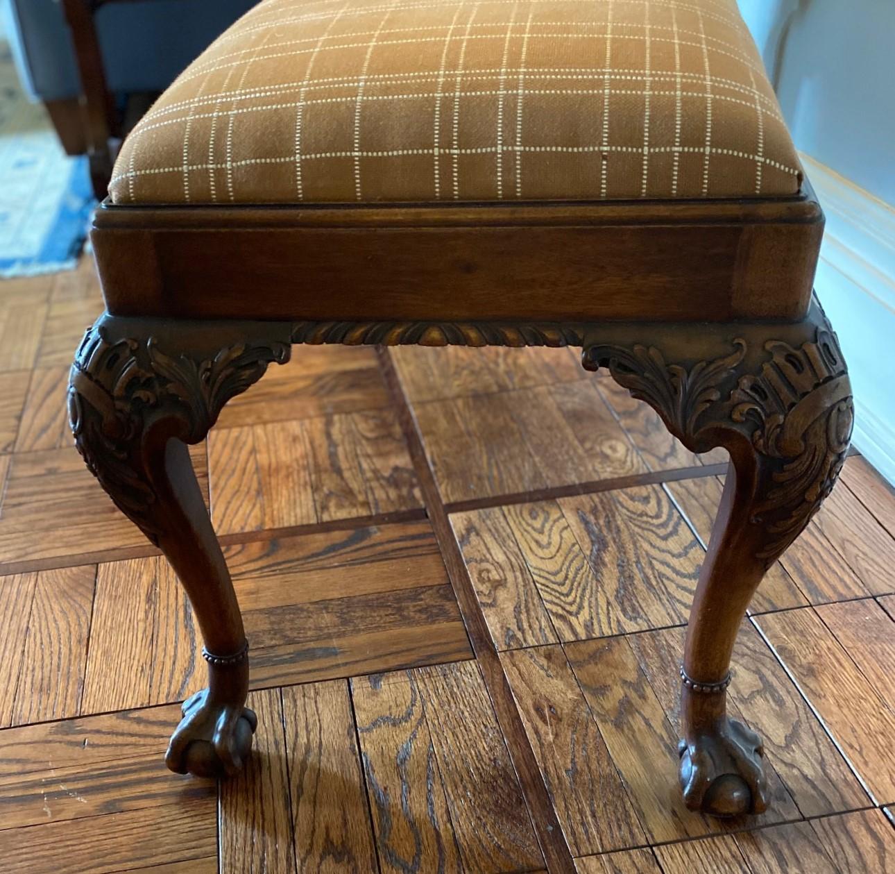 20th c., finely detailed American-made mahogany Chippendale bench by The Company of Master Craftsmen, New York, c. 1926. Carved knees with ball-and-claw feet. The detailing is crisply executed. Please note the carved beaded rings encircling the legs
