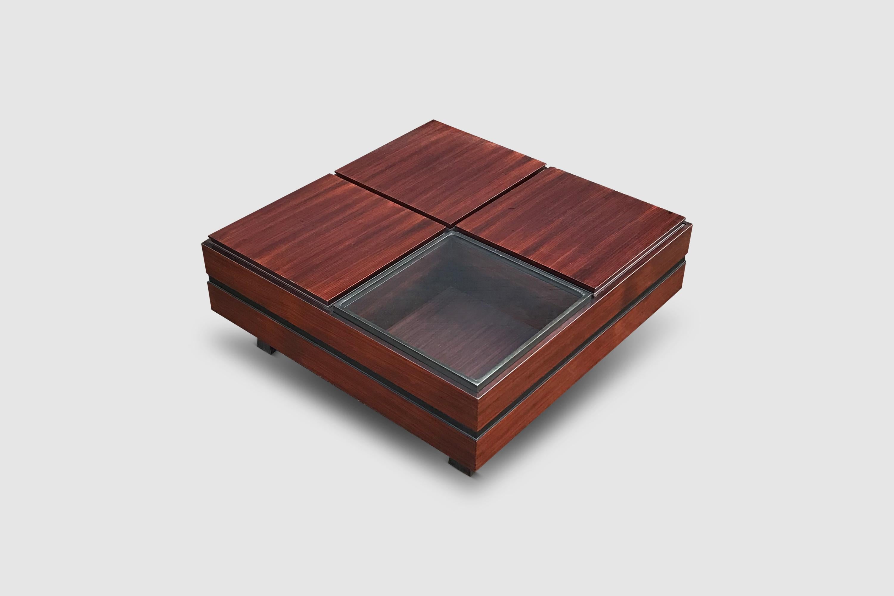 Functional and compartmented teak wood coffee table designed by Carlo Hauner and manufactured by Forma italy 1961.

The table is compartmented into 4 different segments, each segment can be used as a storage compartment thereby providing
