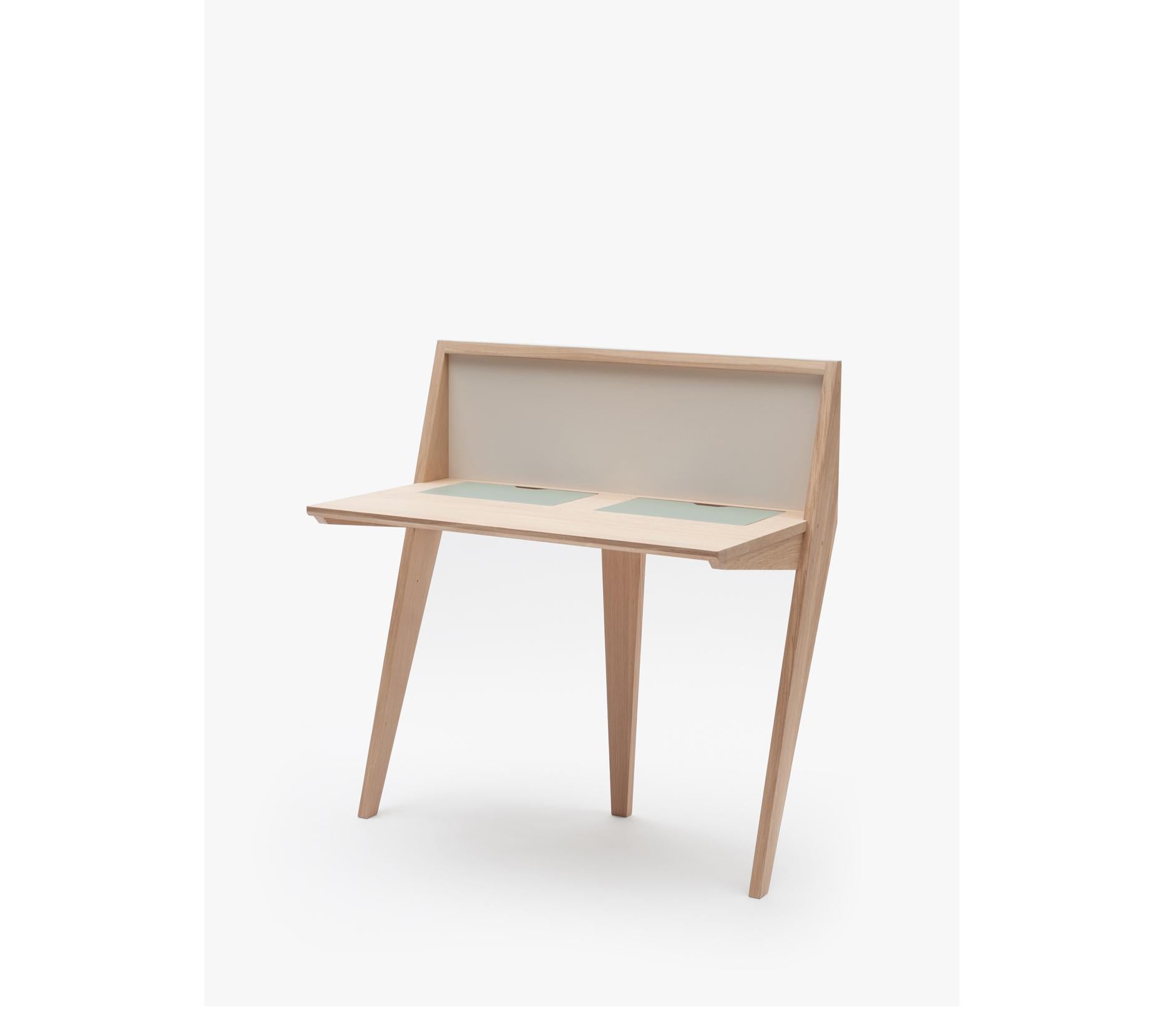 Leaning against the wall, the COMPAS desk is ideal for small places. Simple lines, original design and still so functional: 2 removable flaps giving access to storage space for computer tablets, paper, pencils. It features also a USB port and a