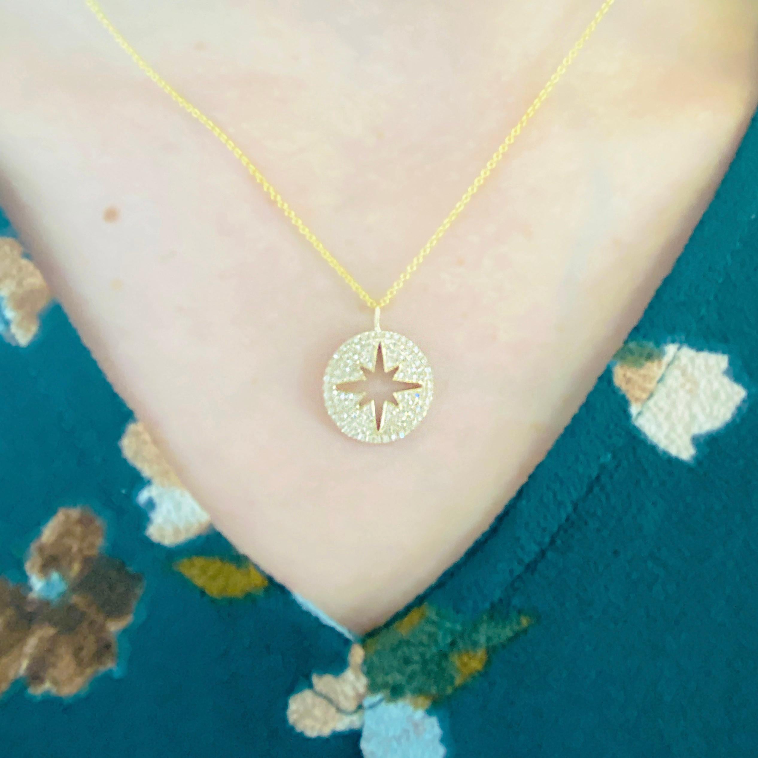 This gorgeous 14k yellow gold pendant dripping with diamonds is the perfect mix between classic and trendy! This necklace represents both the North Star and a compass, symbolizing encouragement and guidance for the journey ahead. This necklace would