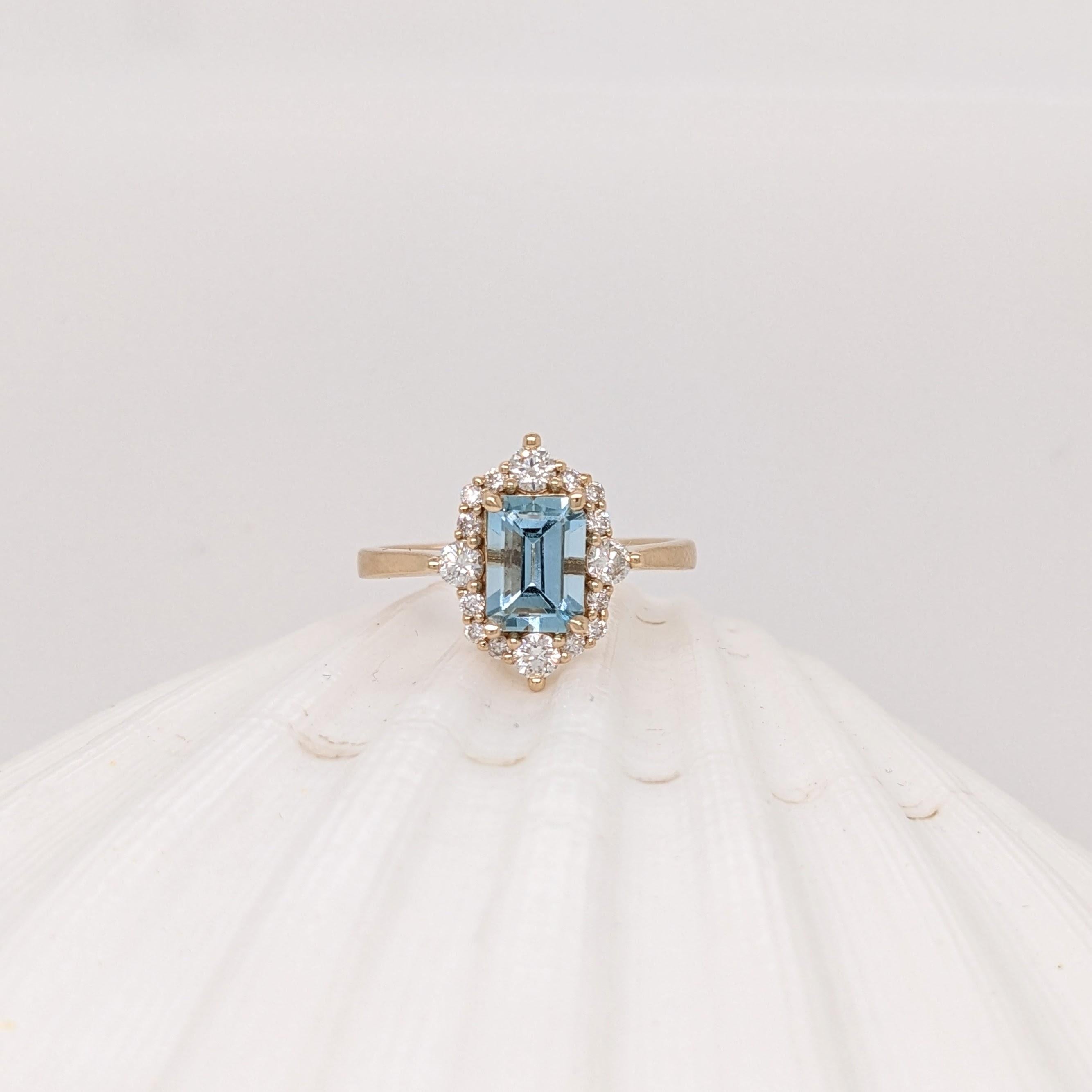 This lovely light blue emerald cut Aquamarine looks beautiful in our custom design NNJ compass rose ring setting with diamond accents in 14k solid yellow Gold. Let this ring remind you of your true north, a perfect symbol of love and trust. A great