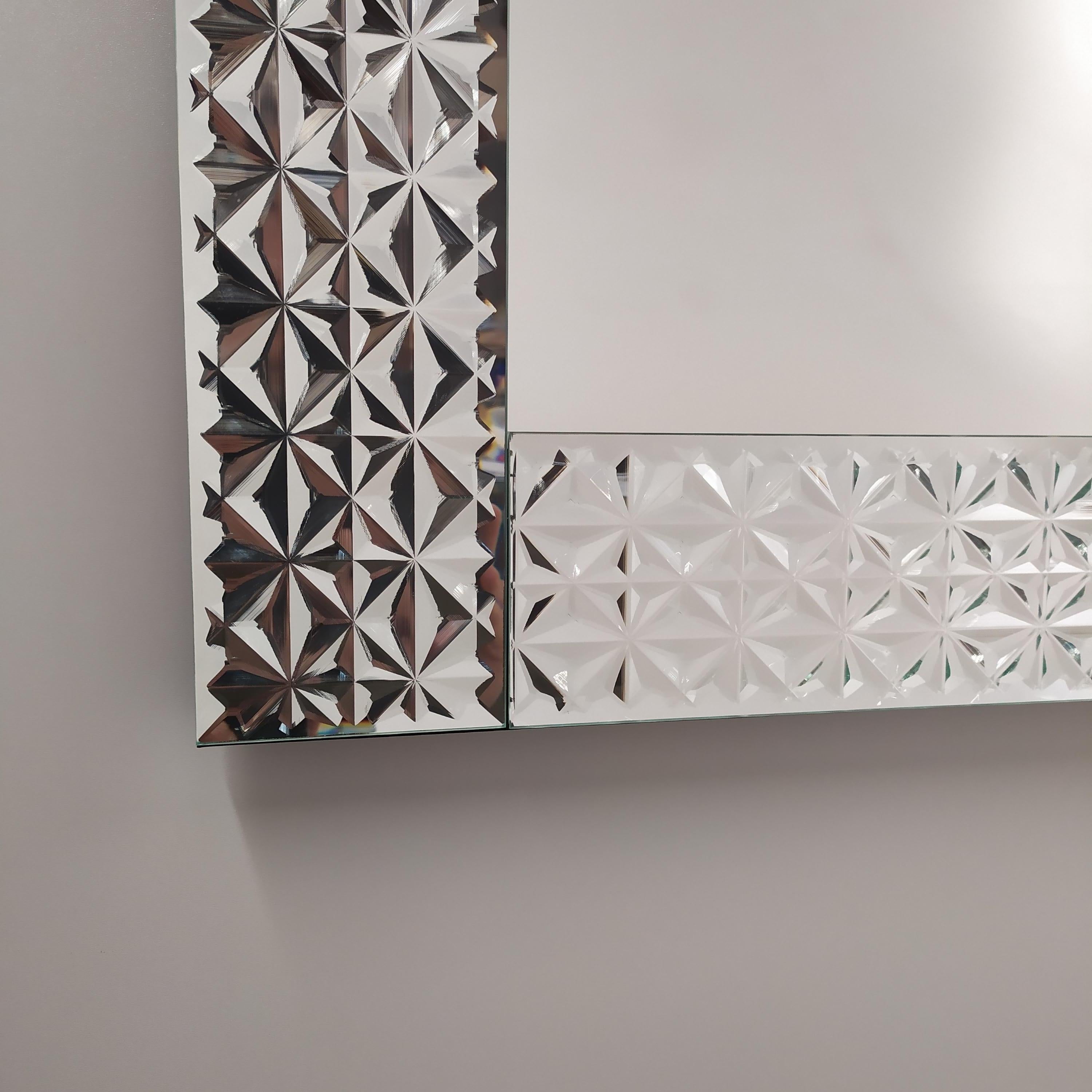 Contemporary rectangular mirror with murano glass frame carved by hand to form an uninterrupted sequence of compass rose, silvered with pure silver produced by Fratelli Tosi to give a shot of brilliance to our homes.