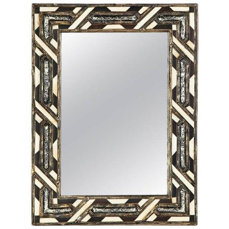 White camel bone, brass and beechwood intersect with entrancing complexity in this pair of compatible rectangular mirrors the contrasting color scheme, the polished textures and brass frame, and the overall choreography lend this pair of mirrors an
