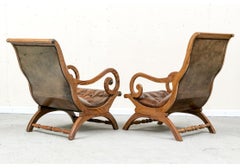 Compatible Pair Of Mahogany Leather Upholstered Lolling Chairs