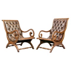 Compatible Pair Of Mahogany Leather Upholstered Lolling Chairs