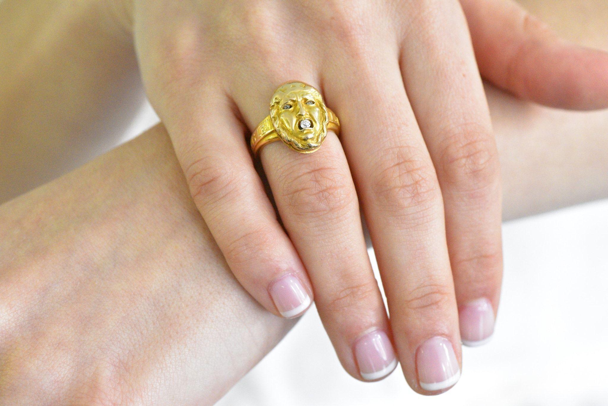 Unusual Victorian poison ring that opens on a hinge to reveal a photo of a man

Ring designed as the face of the mythical God of Truth, centering an old mine cut diamond set within his mouth

Shoulders inscribed 