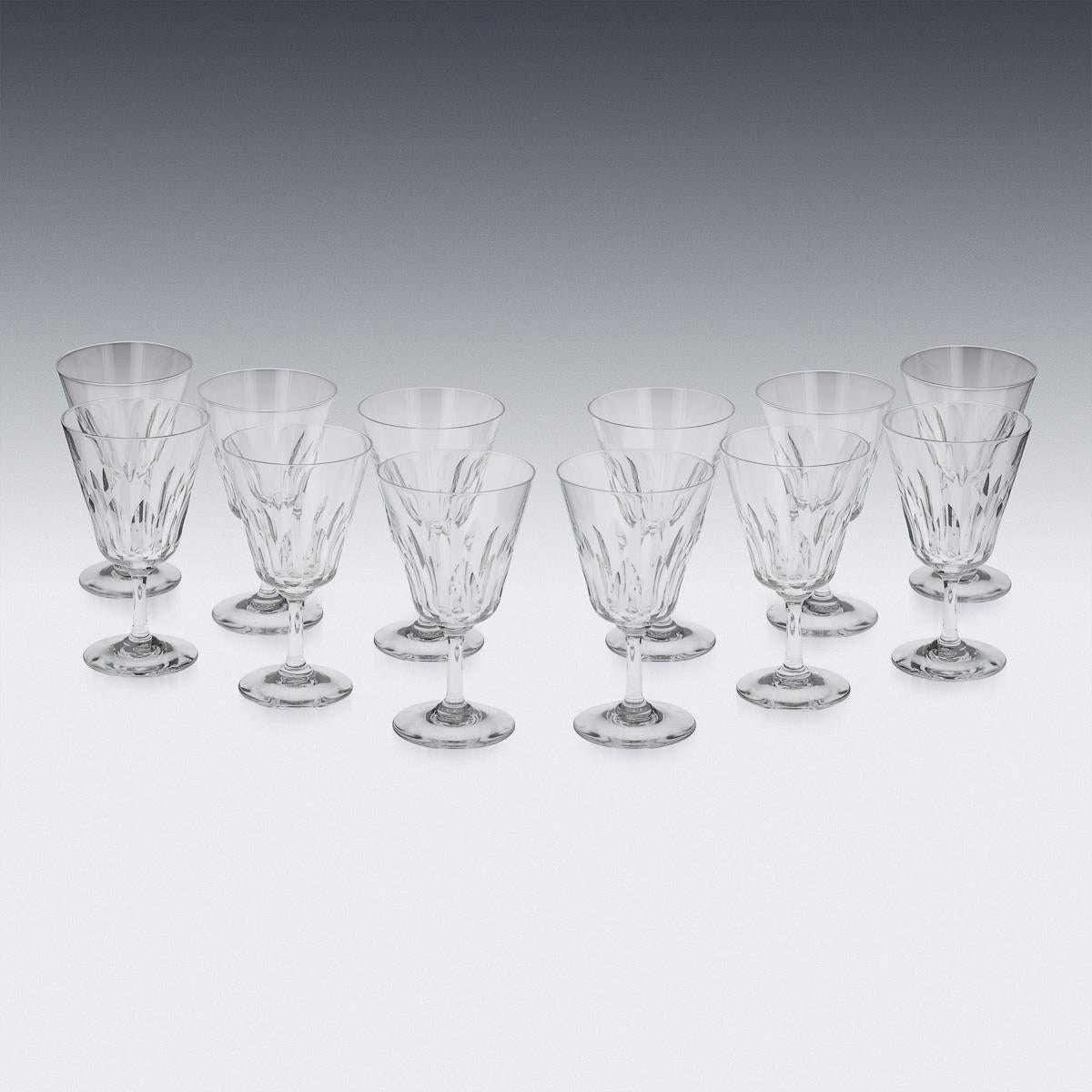 A stunning set of crystal drinking glasses made by the world renowned glass manufacturer Baccarat, France around the middle of the 20th century. This stunning set comprises of twelve red wine glasses, twelve white wine glasses and twelve glasses for