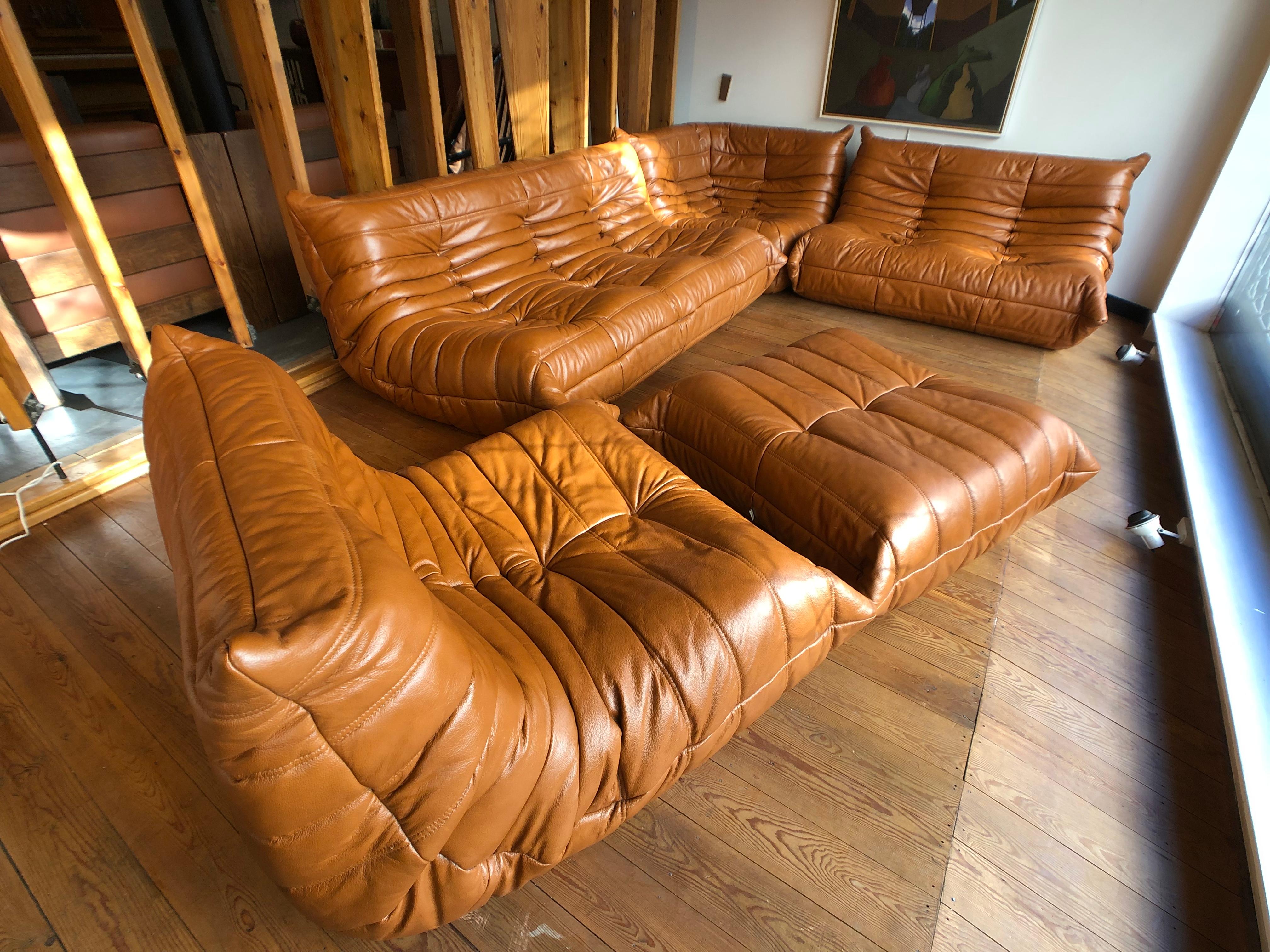 Complete set of cognac leather Togo for Ligne Roset by Michel Ducaroy.
1+2+3+angle+foot seat.
Good condition and original.
Nice patina.
 