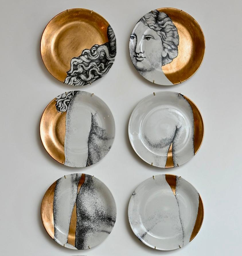 A complete set of twelve vintage ‘Eva’ ceramic plates by Piero Fornasetti, circa 1980. This beautiful design depicts a black and white Eve on a gold background, produced in limited numbers, this collection is one of Fornasetti’s most sought-after