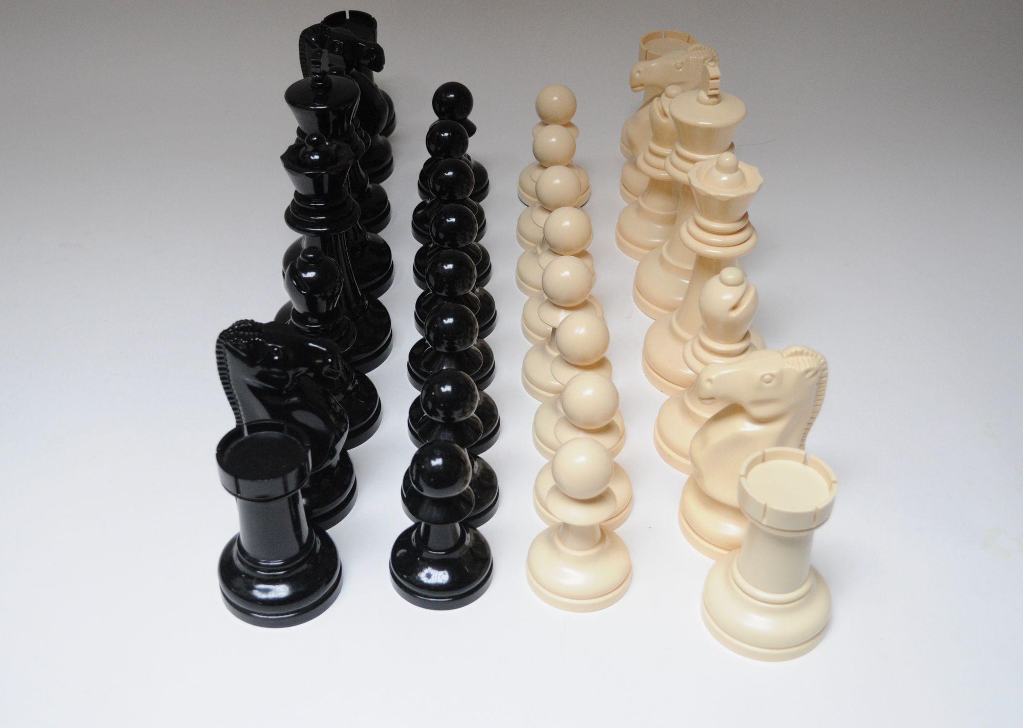 Uniquely large chess pieces in black and cream plastic, ca. 1970s USA.
Full and complete set with no board, though squares would need to be 4