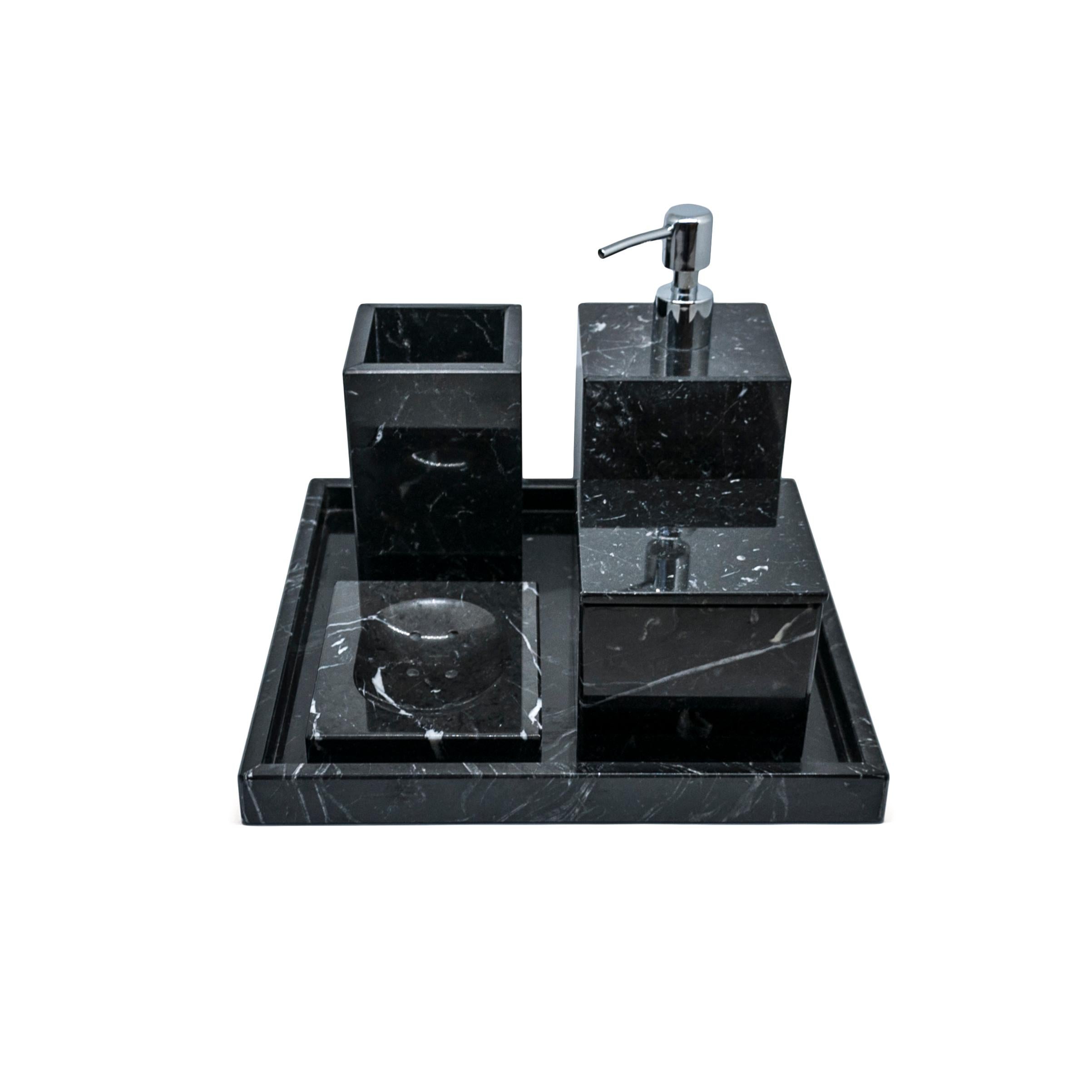 A complete squared set for the bathroom in black Marquina marble which includes: one soap dispenser (9 x 9 x 19 cm), one soap dish (10 x 13 x 2 cm), one toothbrush holder (8.5 x 8.5 x 12 cm), one box holder with lid (9.5 x 9.5 x 9.5 cm), one spa