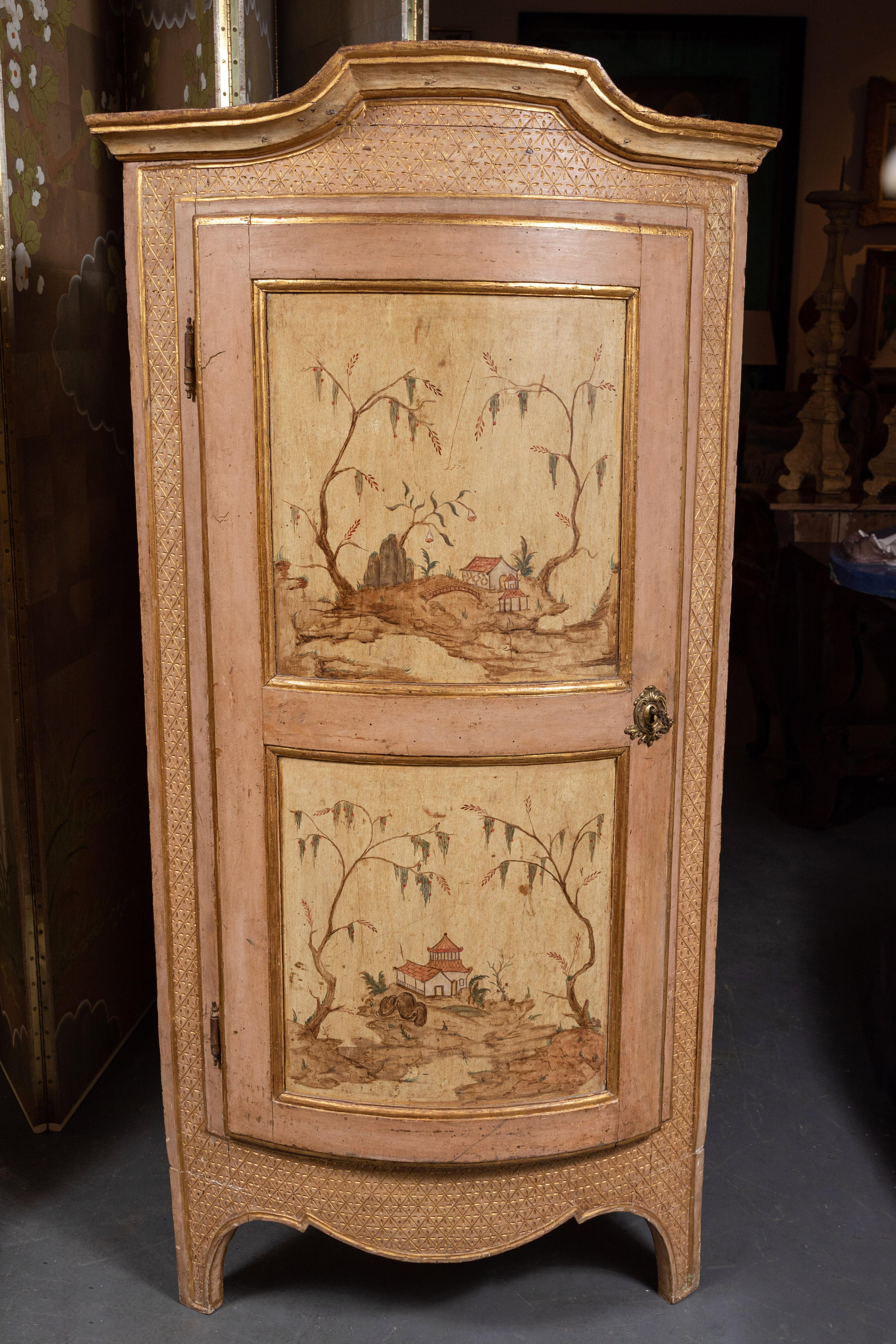 Pair of fine, circa 1750, hand carved and painted, rounded, Venetian, Chinoiserie corner cabinets in blush and crème. Each featuring two, uniquely painted doors, and surrounded and surmounted by a sunken, quilt-style, gilded relief pattern.
