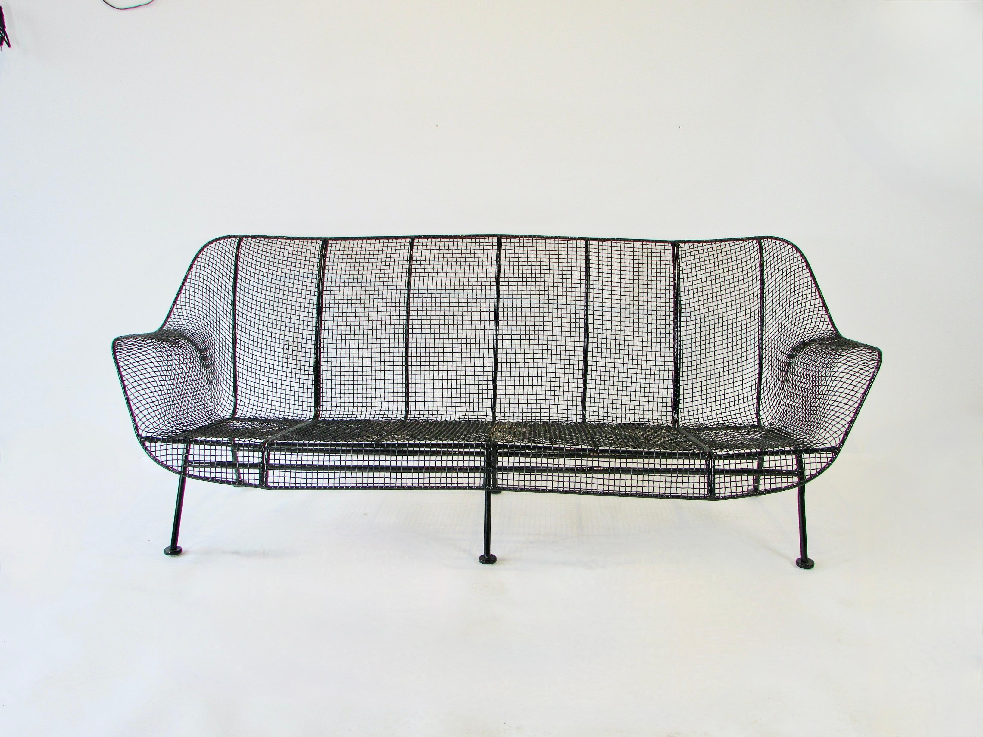 Wrought iron with steel mesh couch by Woodard. From the sculpture line fresh modernist design. Maybe the best available, finished in gloss black powder coat with new glides added.