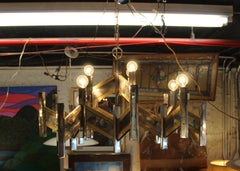 Lampadario in metallo complesso con finiture in ottone