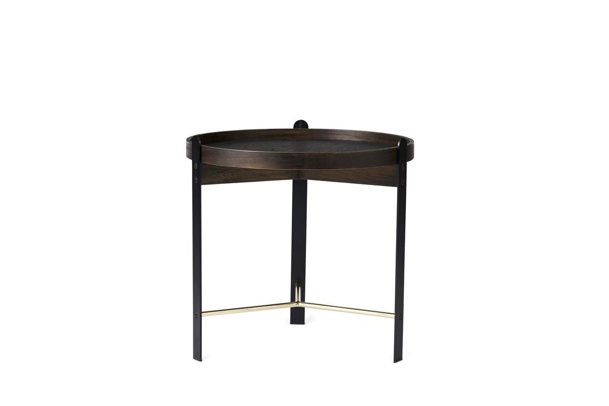 Compose Side Table Smoked Oak Brass Black by Warm Nordic
Dimensions: D50 x H49 cm
Material: Smoked oak veneer/Powder coated steel and brass coloured frame
Weight: 2.5 kg
Also available in different finishes. Please contact us.

Stylish coffee
