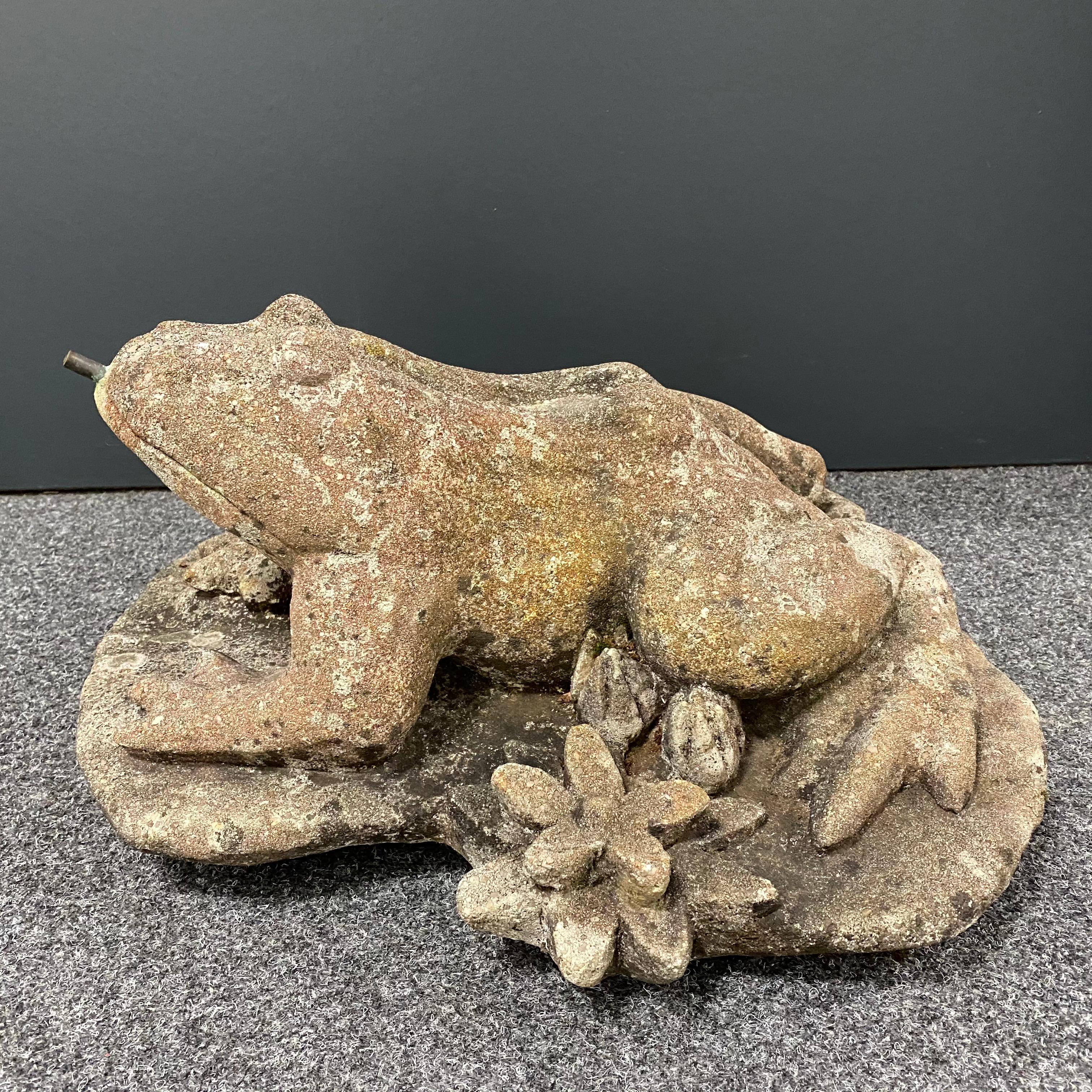 Delightful stone frog sitting atop a lily pad. Copper pipe from the back to the under the frog to his mouth for fountain attachment. Nice original vintage condition. It weights about 64.8 pounds or 29.4 kilograms. It looks a lot better than what you