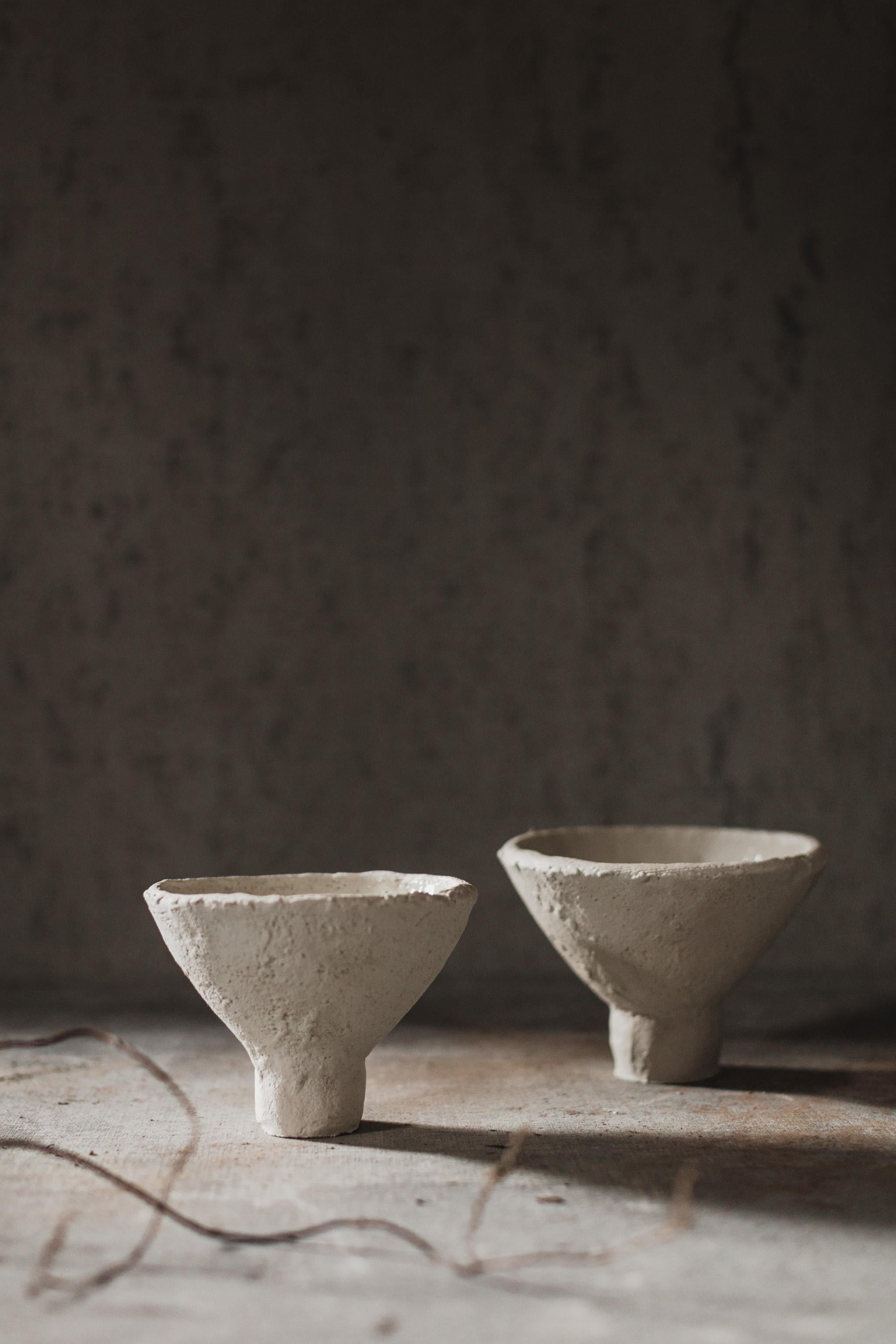 Mugly NYC is a Brooklyn based ceramic studio specializing in richly textured sculptural clay and porcelain that evoke the poetics of the handmade.

These Compote Vessels were handmade in 2022 with highly textured white sculpture clay and porcelain