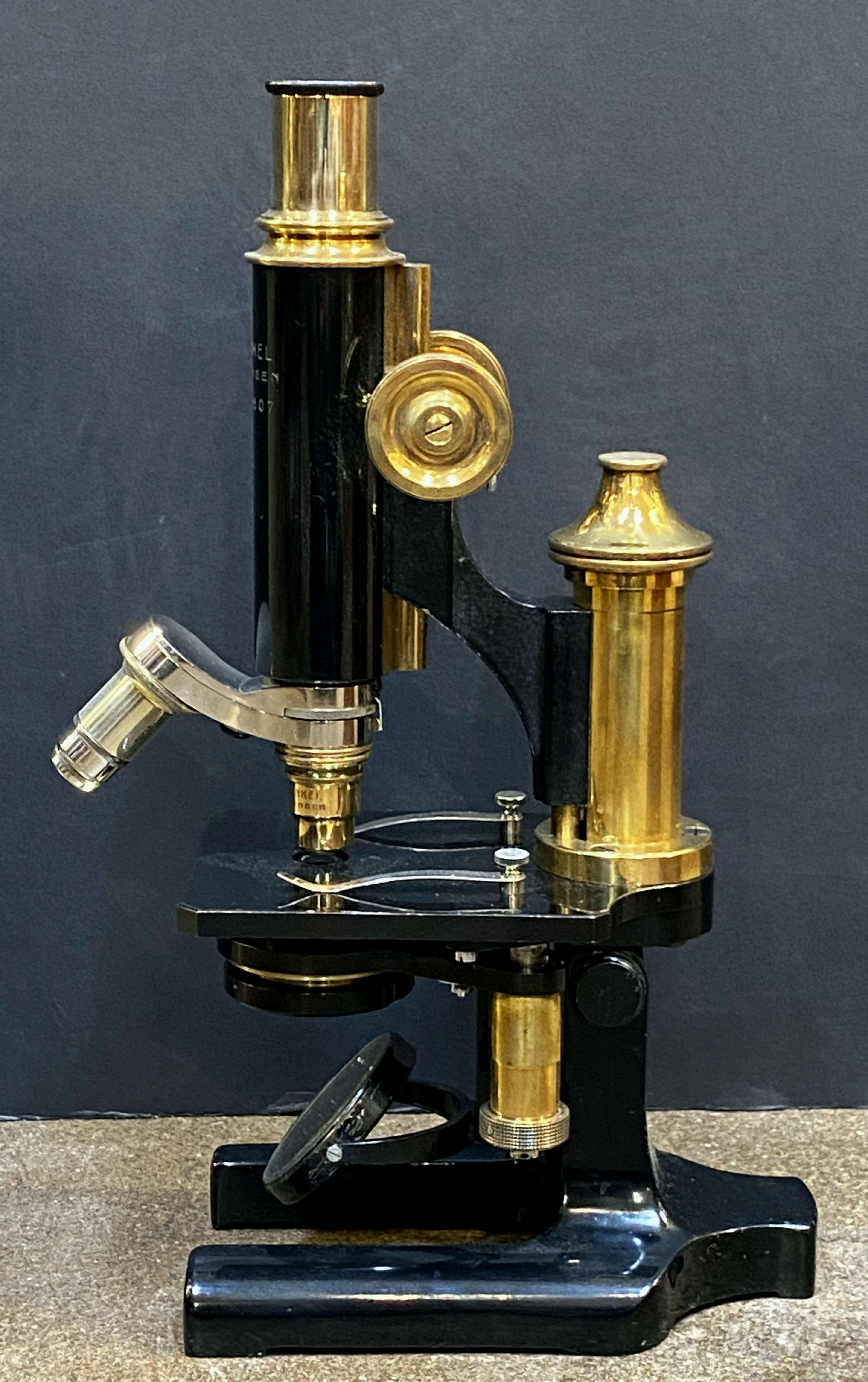 antique microscope in wooden box