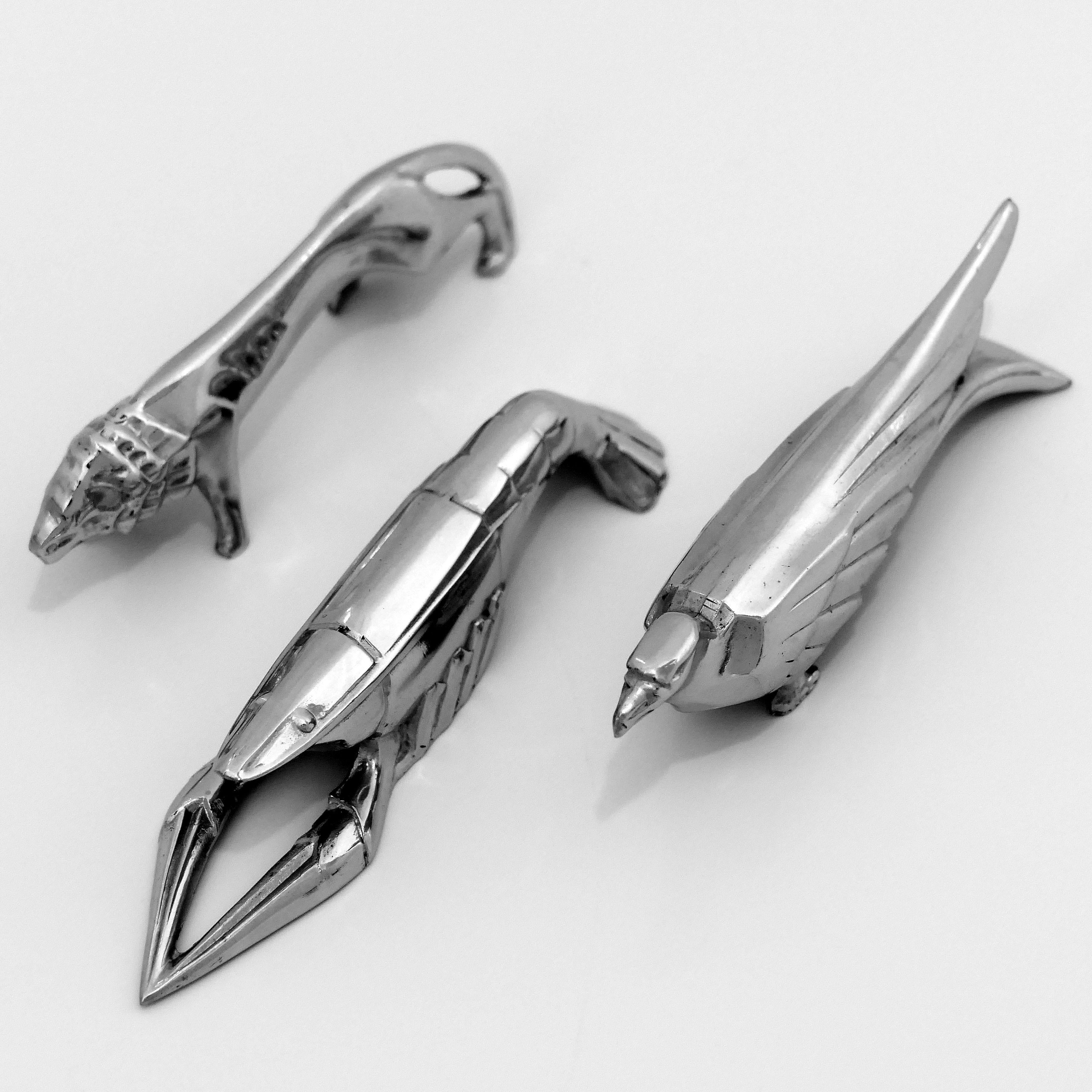 Rare set of ten chrome-plated metal knife-rests in the shape of different animals: lobster, lion, grasshopper, cock, monkey, eagle, fish, sea lion, puma and duck, circa 1920-1930. 

The knife rests feature the characteristic of the Art Deco style