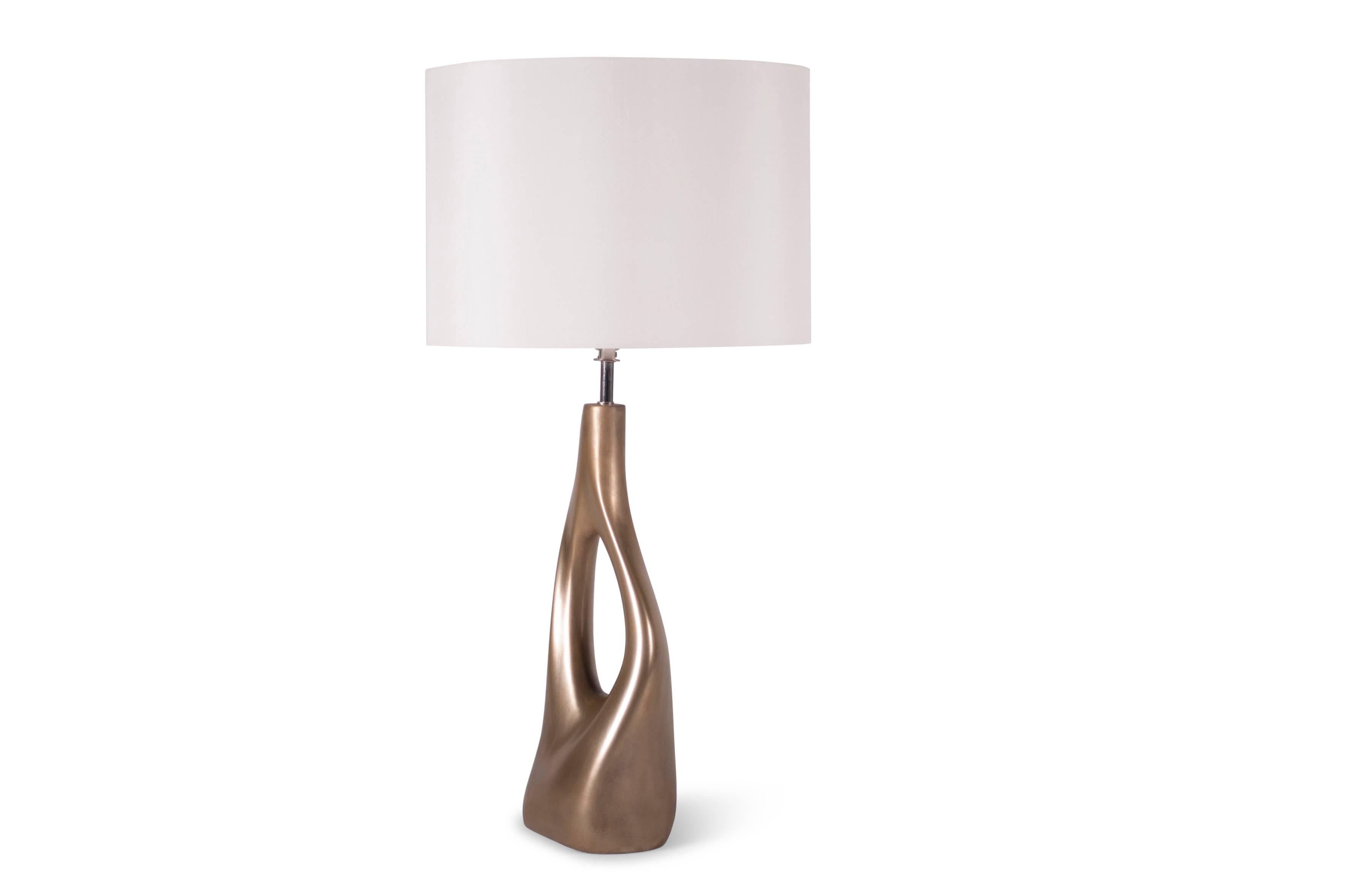 sculptural table lamp is made from MDF with Cold Metal finish. Color: Gold 
Dimension base: 16
