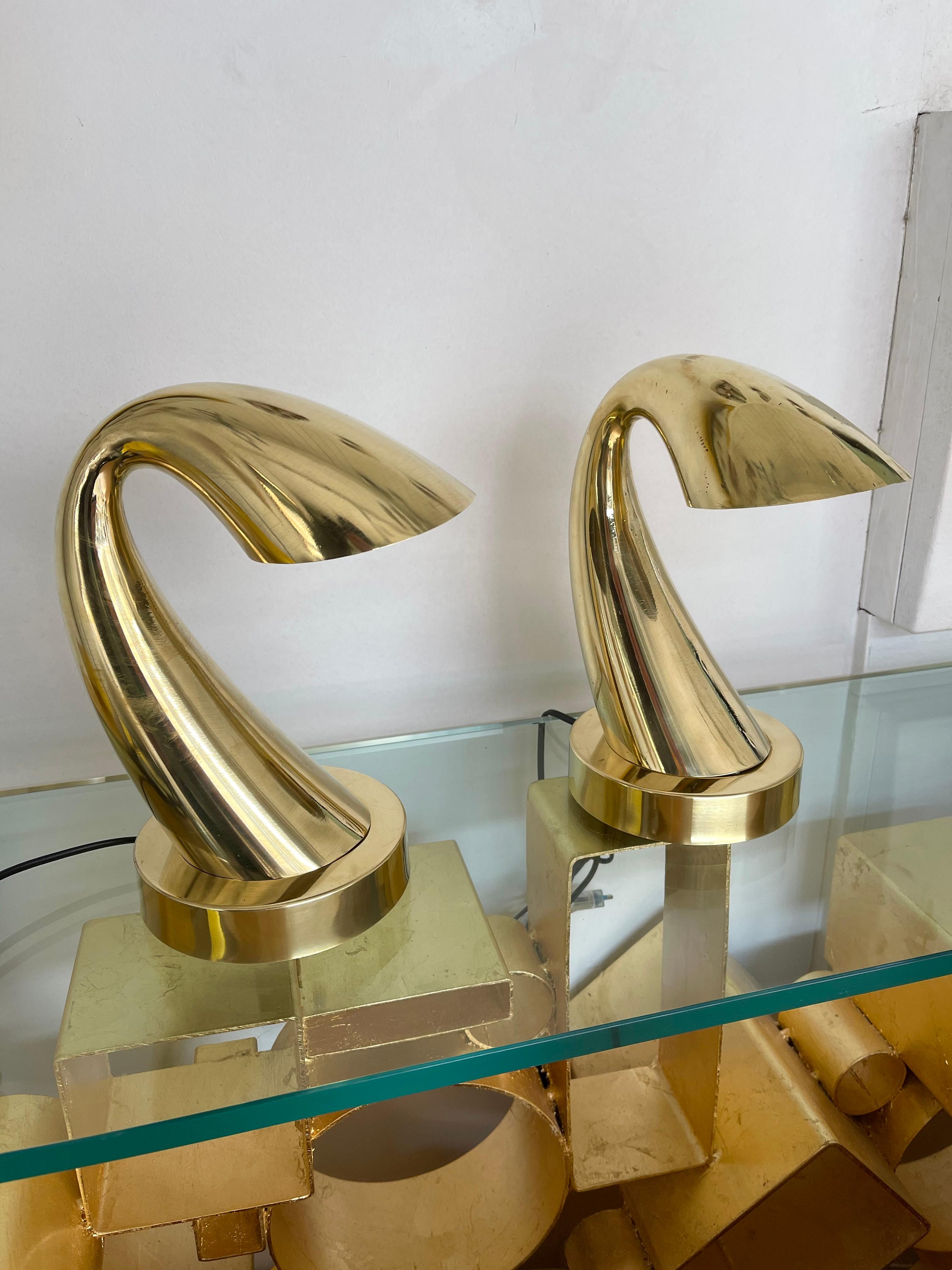 Pair of table or bedside brass horn tube lamps.