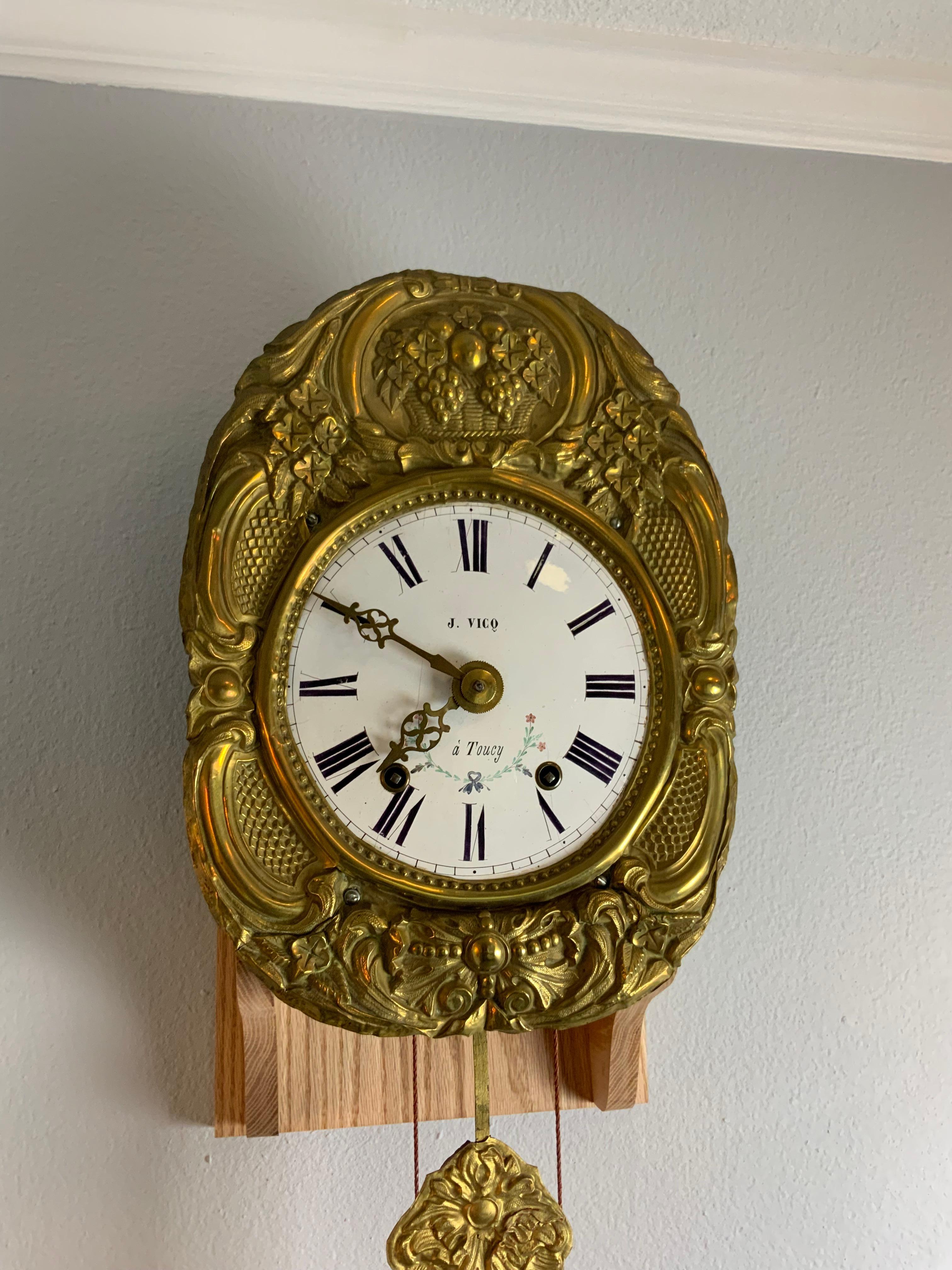 Morbier wall clock movement with the weights, key and balance. Strikes on the hour and two minutes after and on the half hour.  This clock has just been professionally cleaned and serviced and runs very well and keeps great time.  Some minor dents