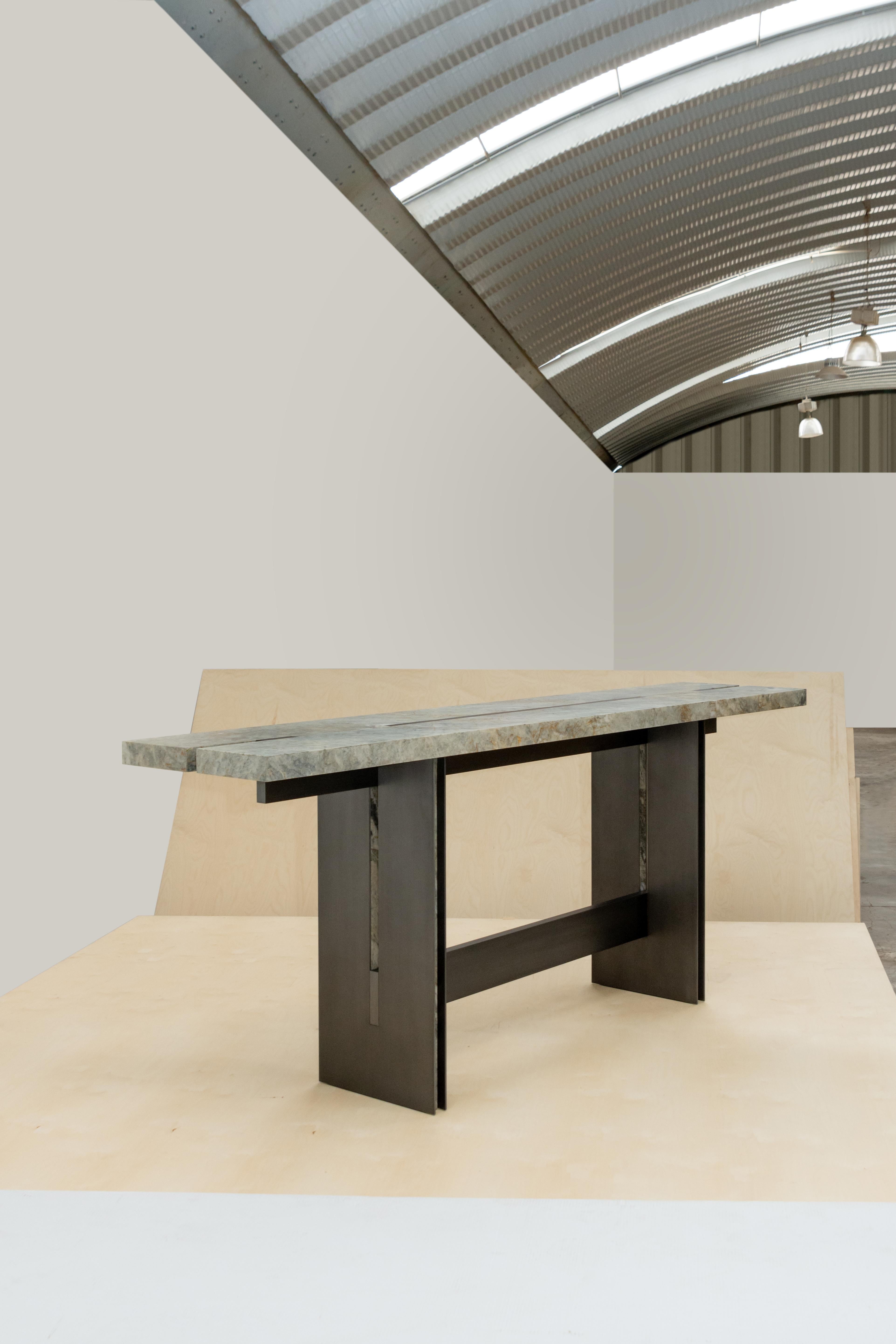 Comunal bar console by Simon Hamui
Dimensions: D290 x W55 x H102 cm
Materials: Stone, Metal
Also available in different dimensions. 
Prices may vary according to the finish chosen.

Bar console in a stone countertop with metal inlays that sits