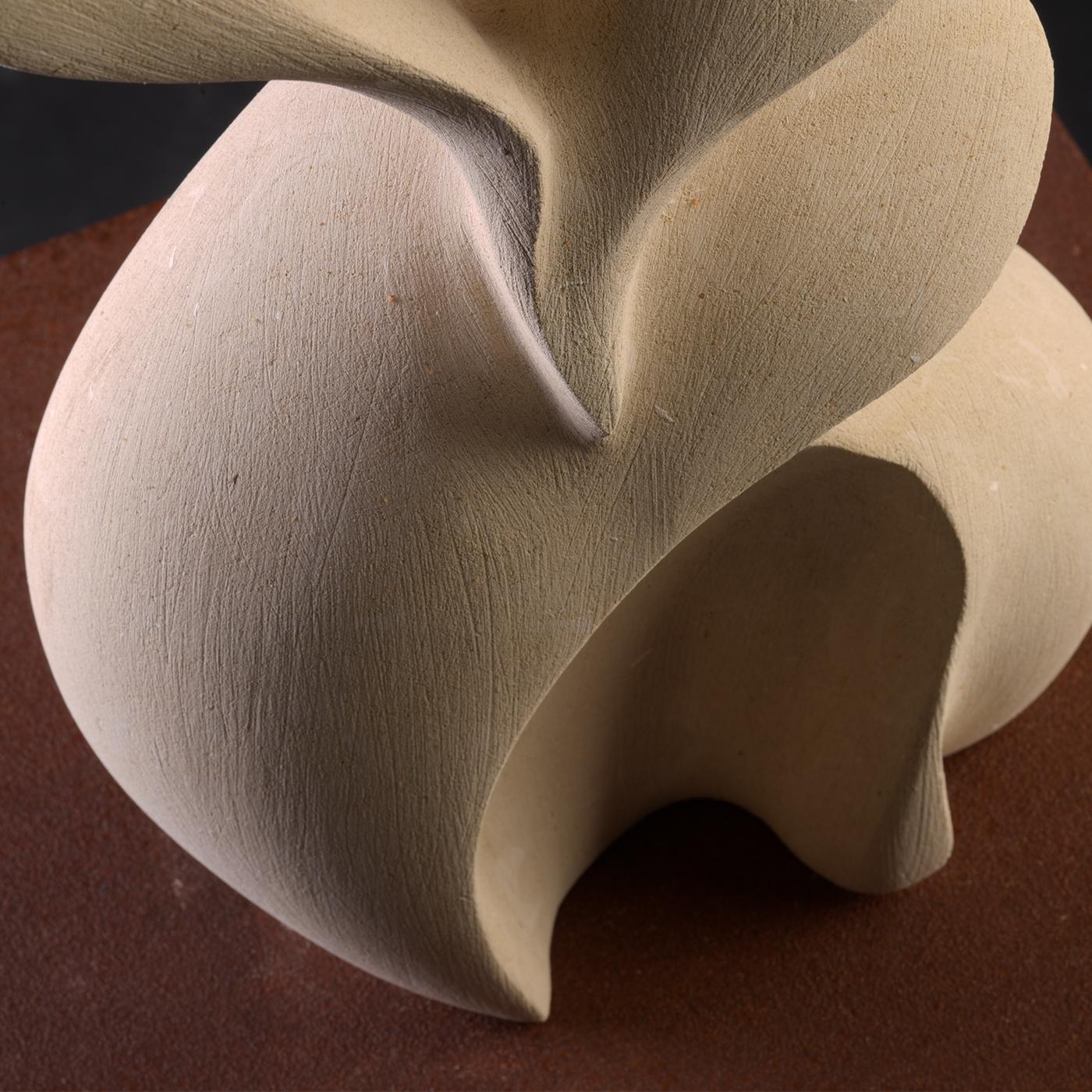 The Con Te sculpture captures the essence of a profound and sincere bond through its flowing, embracing forms that evoke intimacy and mutual support. Carved from a rare marine-origin stone found only in select areas of southern Italy, the piece
