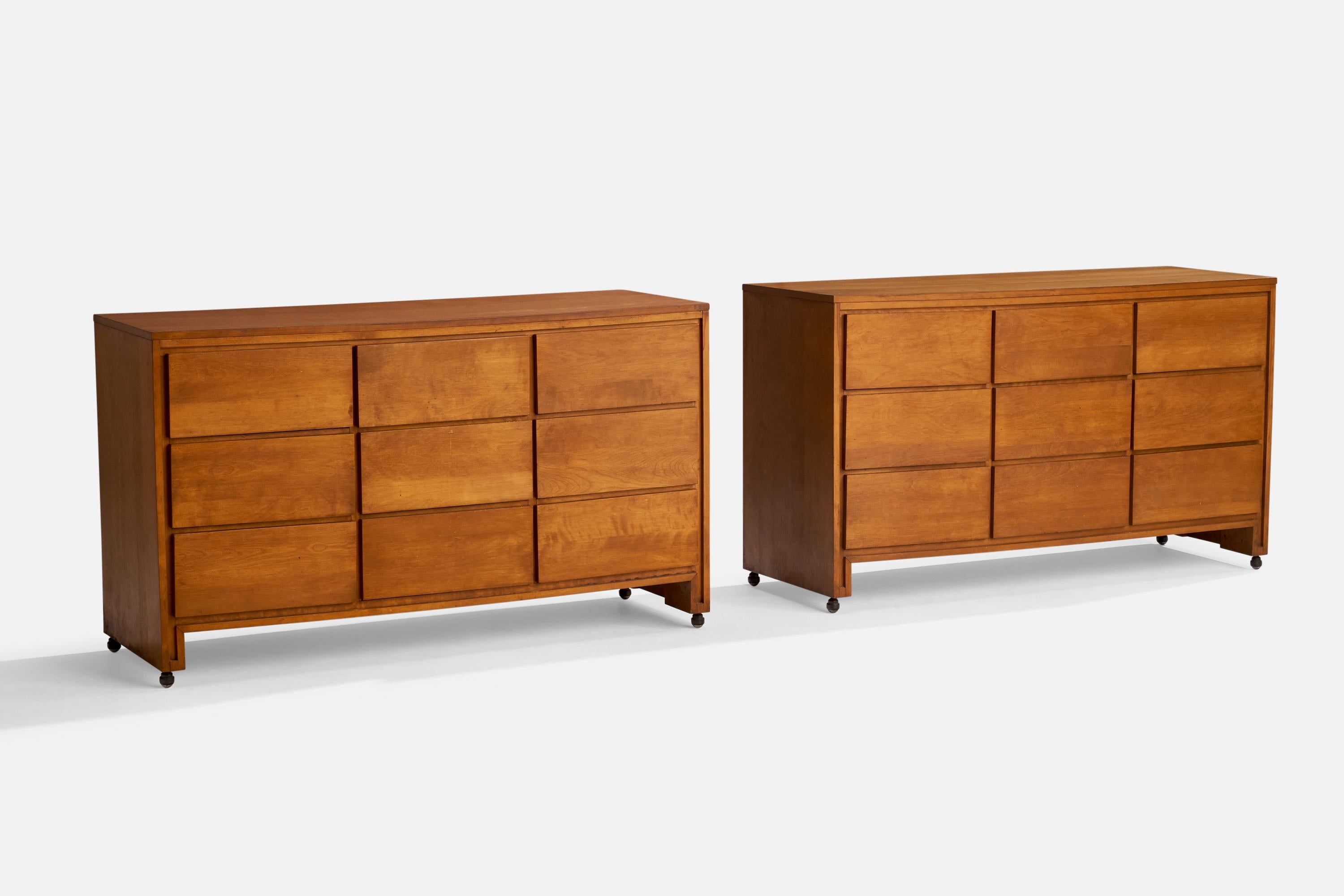 A pair of walnut chests of drawers designed and produced by Conant Ball, USA, 1950s.
