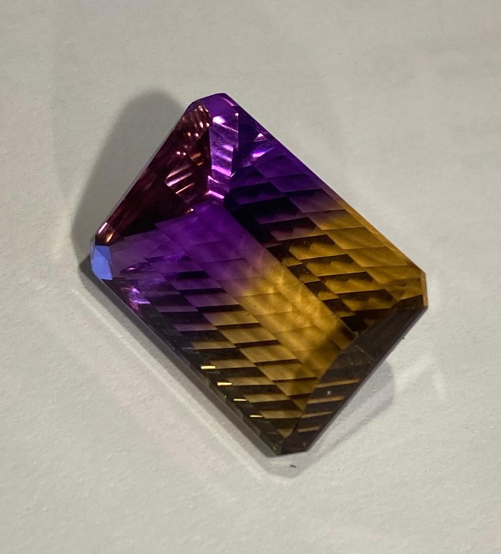 A Concave Cut Ametrine, Half Amethyst and Half Citrene For Sale 2