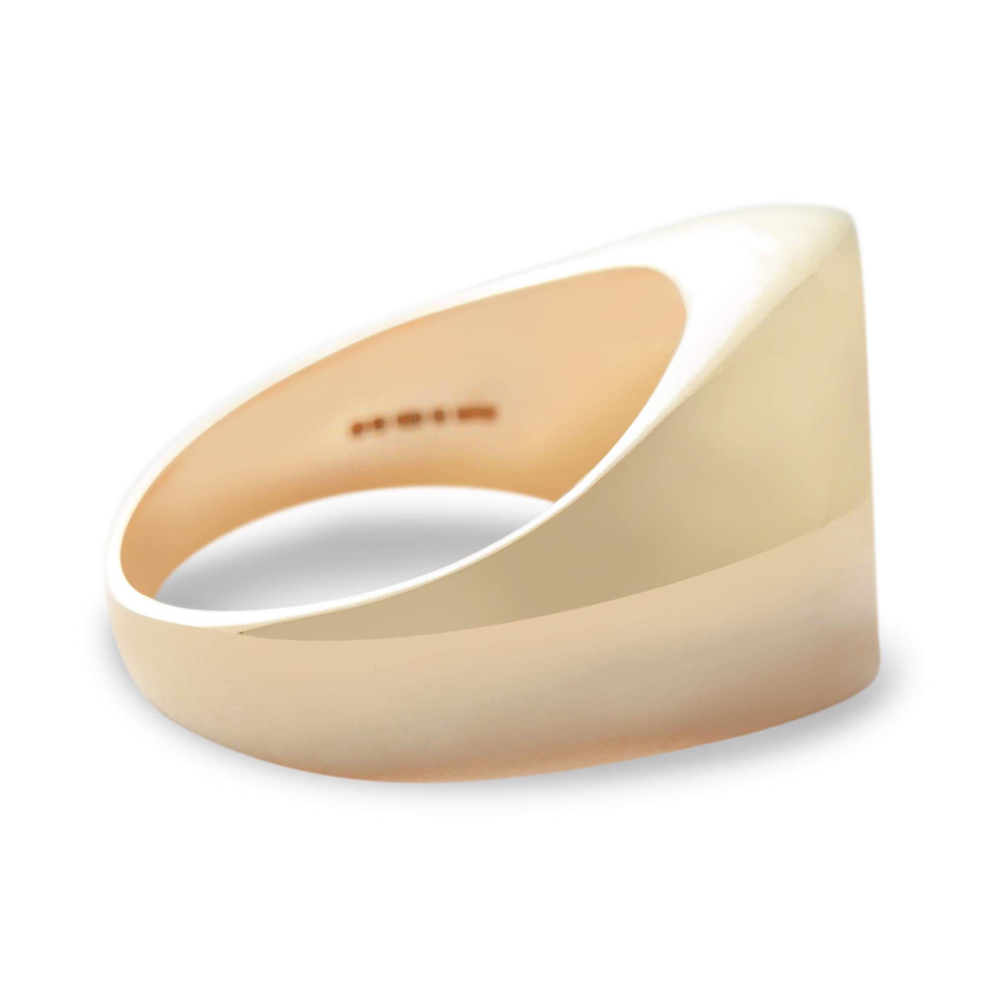 This curvaceous, contemporary take on the classic signet ring is crafted from solid 9-carat yellow gold with a high-polish finish.  The ring is in stock in a UK size L 1/2 (equivalent to US size 5 7/8 or European size 52 1/2) and can be resized upon