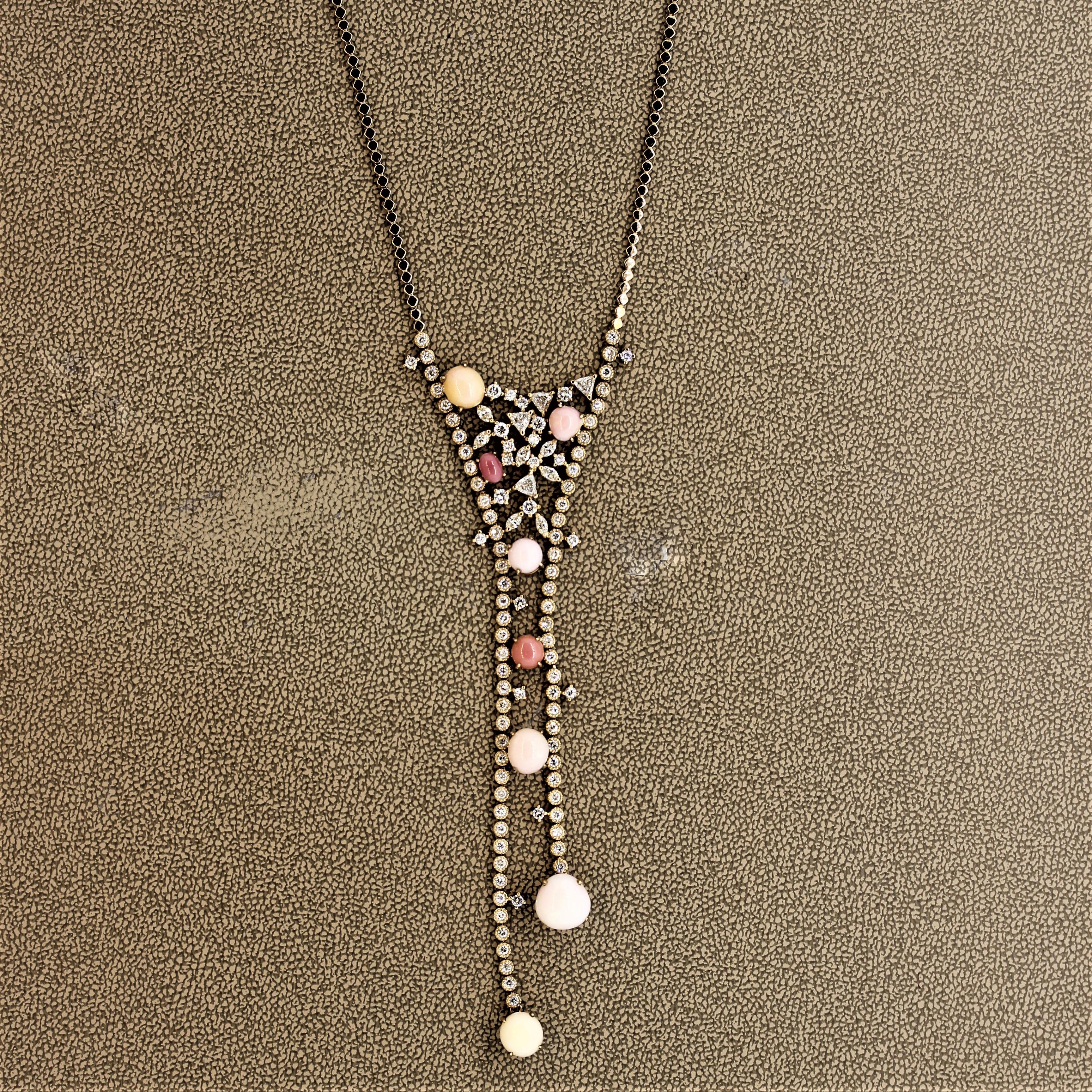 A one-of-a-kind piece featuring natural and rare conch pearls. There are a total of 8 conch pearls ranging from a cream color to vivid pinks and weigh a total of 12.40 carats. Adding to that are 2.50 carats of round brilliant and triangular cut