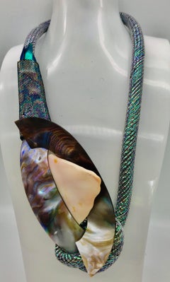 Conch shell and iridescent Camberlainia eco - luxe Pendant , by Sylvia Gottwald