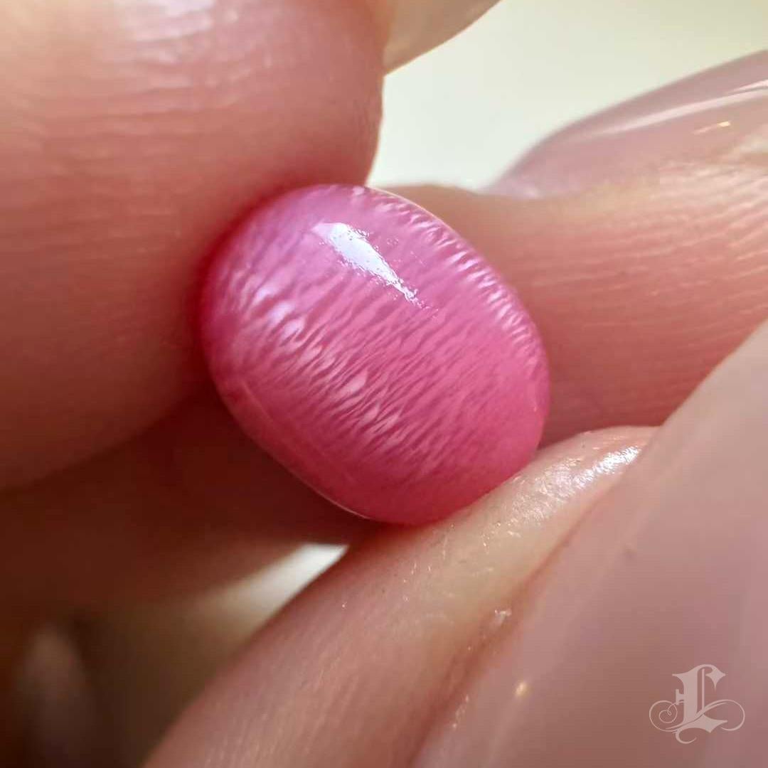 A masterpiece of nature, this 3.56ct conch pearl (9.1×7.3mm) belongs to the rarest echelon of collector’s grade treasures. Its mesmerizing flamingo pink radiates with a velvety flame pattern that dances across the surface, embodying both intensity