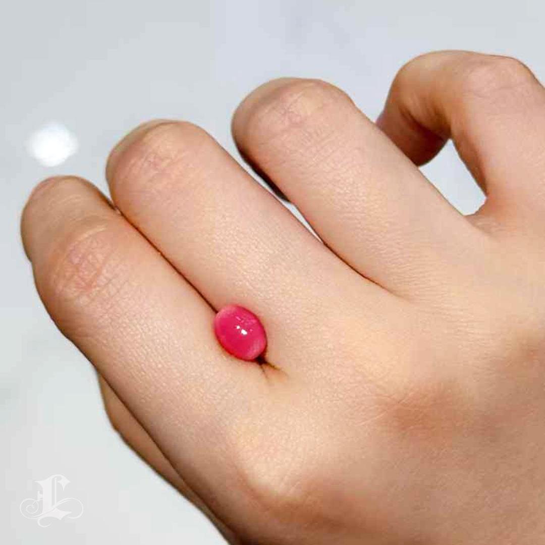 A refined and luminous treasure from the sea, this 2.34-carat natural conch pearl embodies the depth and intensity of a velvet dawn. Its deep pink hue—a rare and coveted color grade—is both vibrant and elegant, evoking the warm richness of garnet