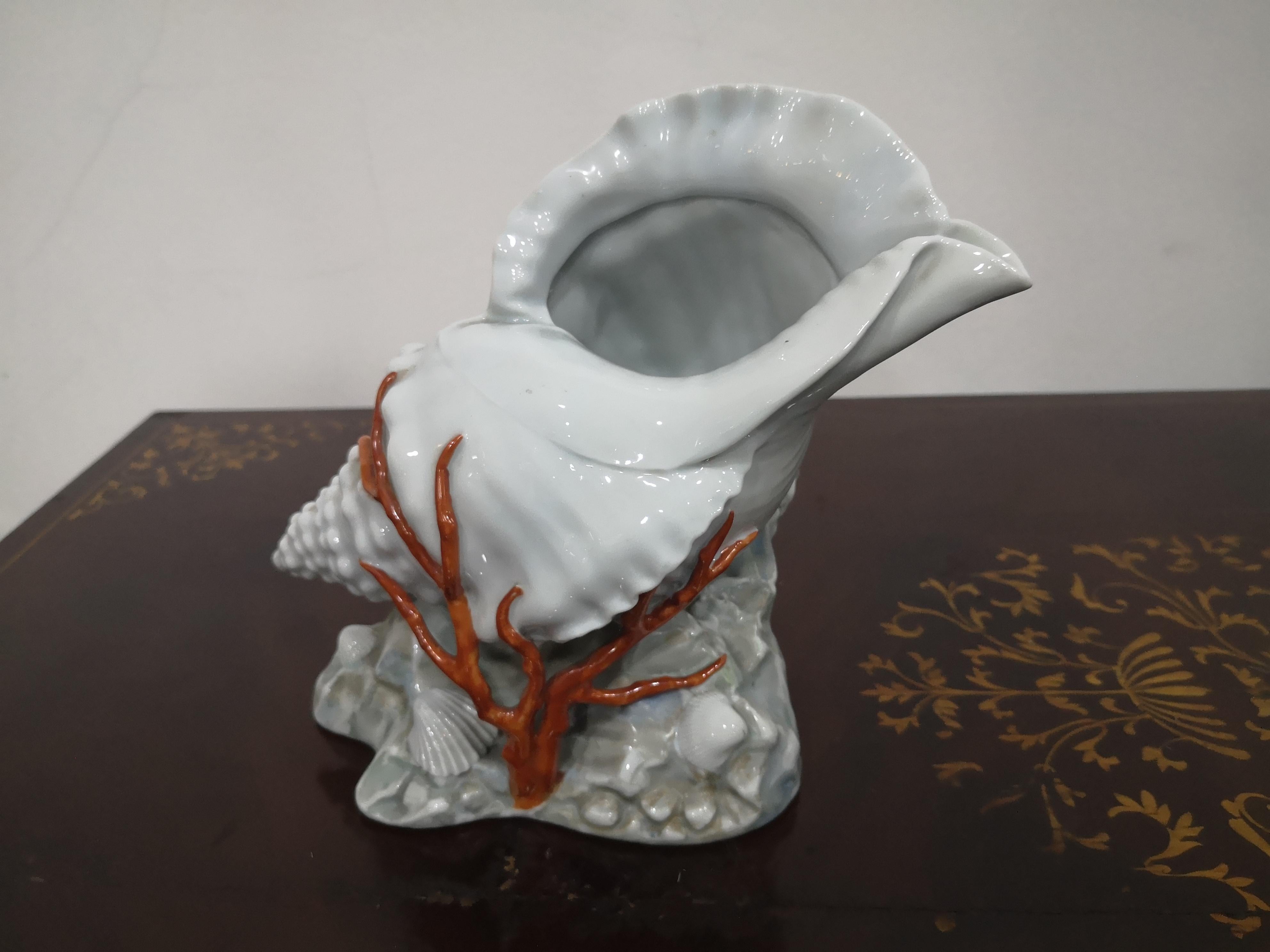 Beautiful Capodimonte porcelain shell with hand-painted coral. The body is in splendid condition, no signs of wear or broken or missing parts. Marked on the bottom, see photos for details. Available to send additional detail photos upon request.