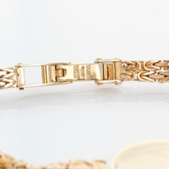 Montre habillée pour dames en or jaune 14K avec diamants et rubis Concord Watch