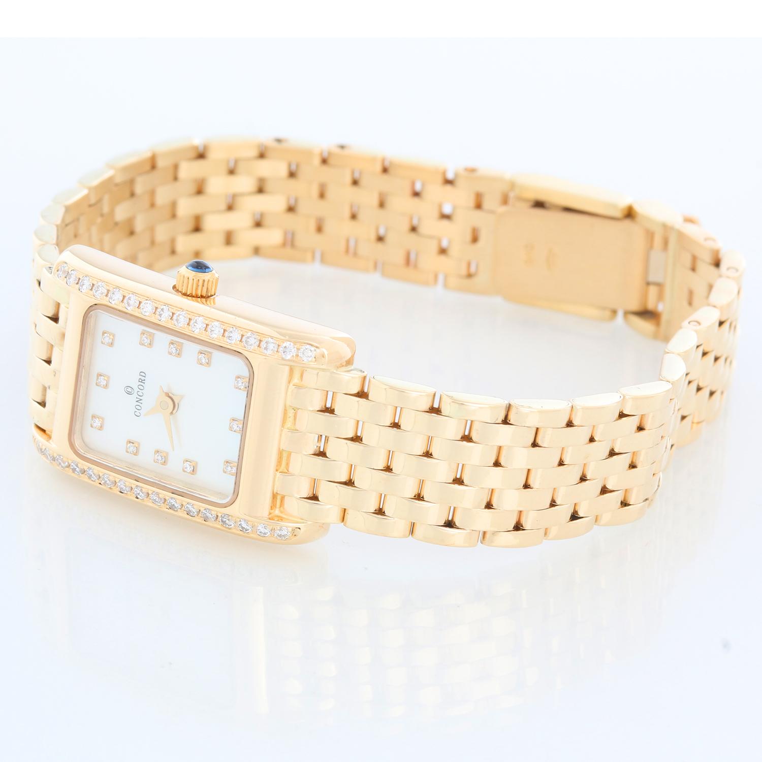 Concord 14K Yellow Gold La Tour Ladies Watch - Quartz. 18K Yellow gold case ( 17 mm ). Mother of Pearl dial with diamond hour markers. 14K Yellow gold bracelet. Will git up to a 5.75 inch wrist. Pre-owned with custom box .