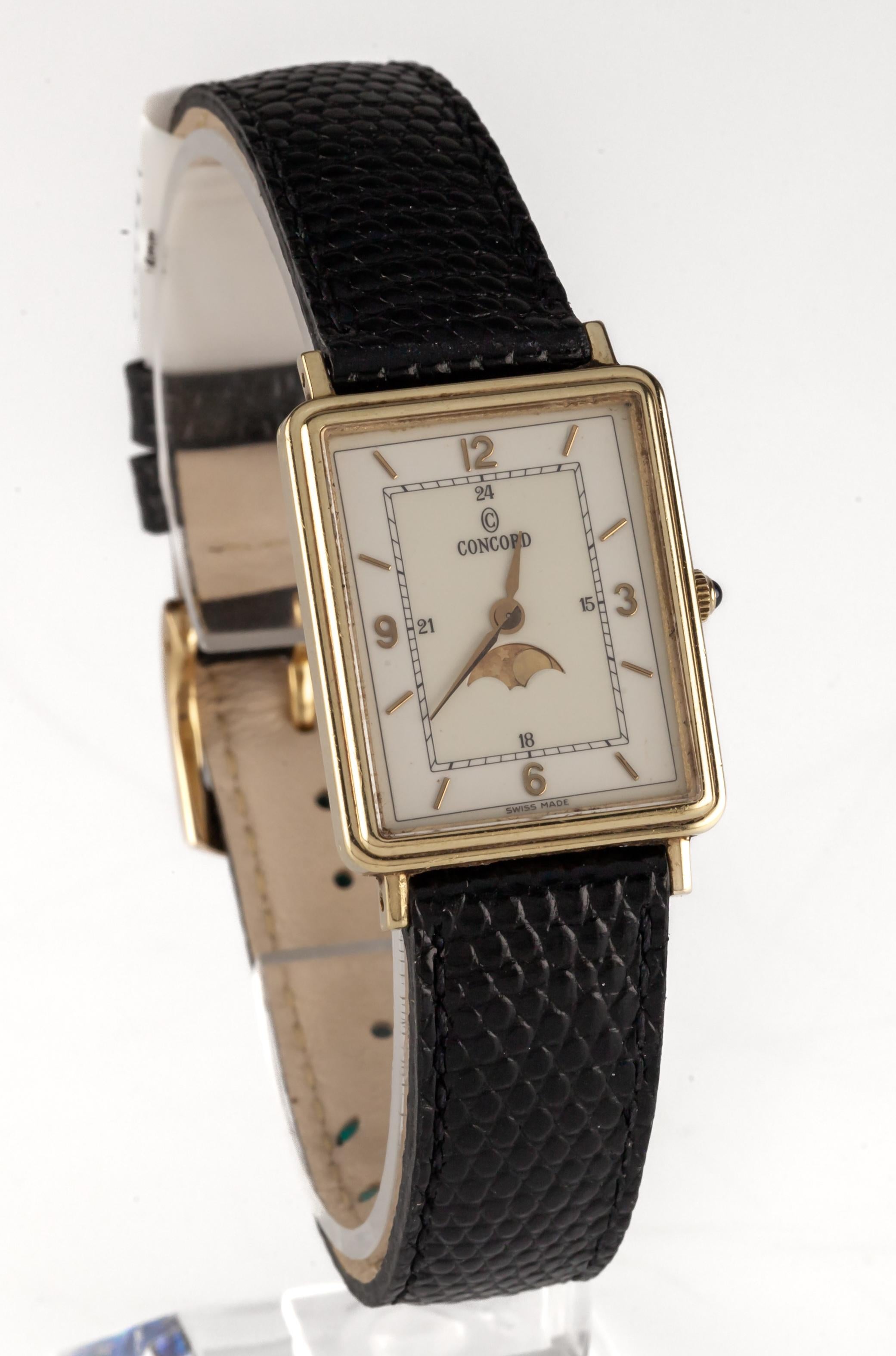 Concord 14k Yellow Gold Moonphase Quartz Tank Watch w/ Leather Strap

Reference #20.63.617
Serial #931092
7 Jewels Quartz Movement

14k Yellow Gold Tank Case
24 mm Wide (26 mm w/ Spinel Cabochon Crown)
29 mm Long
Lug-to-Lug Width = 16 mm
Lug-to-Lug