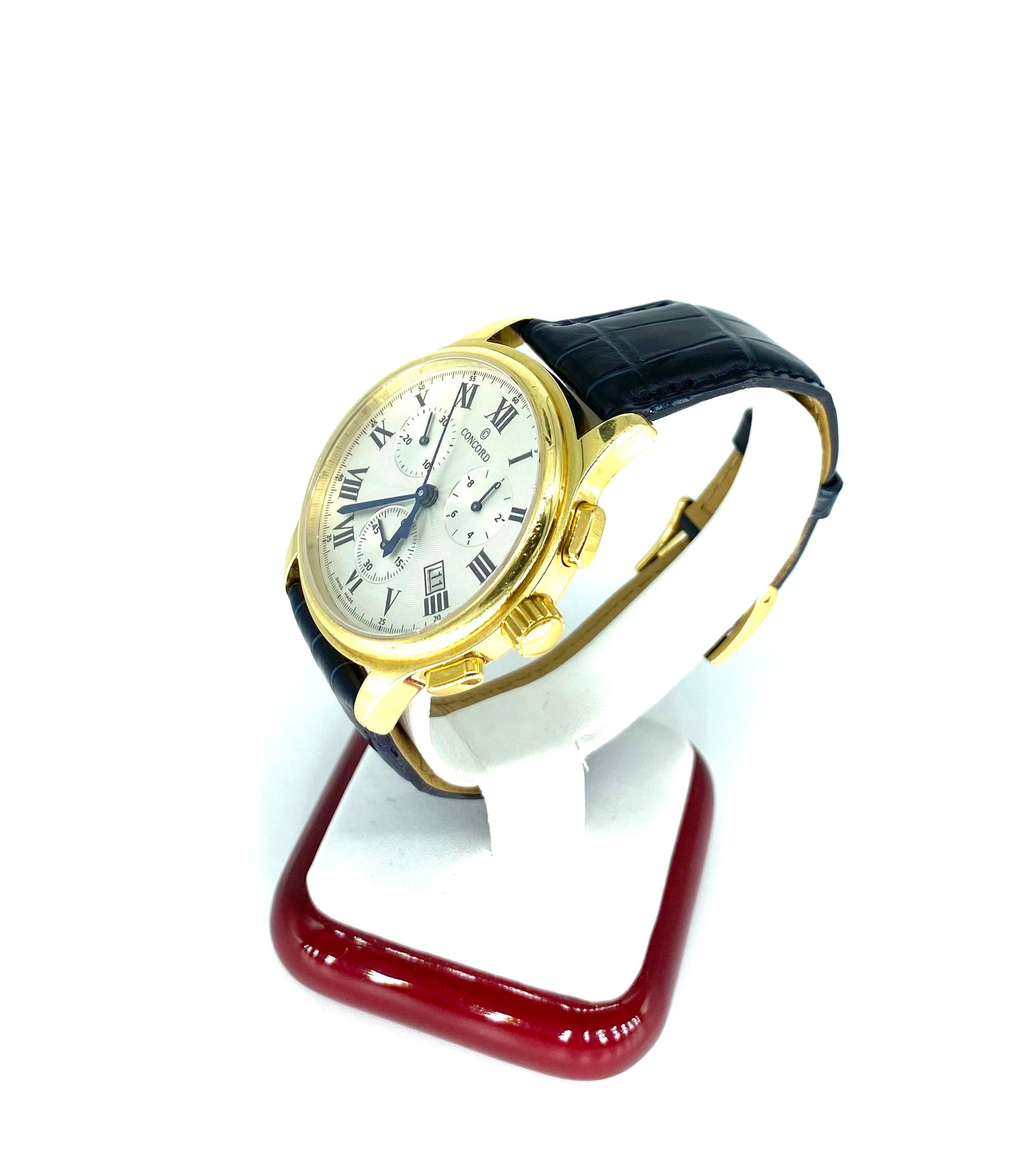 Concord wristwatch with 3 subsidiary dials, a date window, stop watch function. This large 18k gold Concord watch is numbered 50C51893, 1315438. This Swiss made watch is in fine condition, 43.5 mm. across including the crown. The band is a new Blue