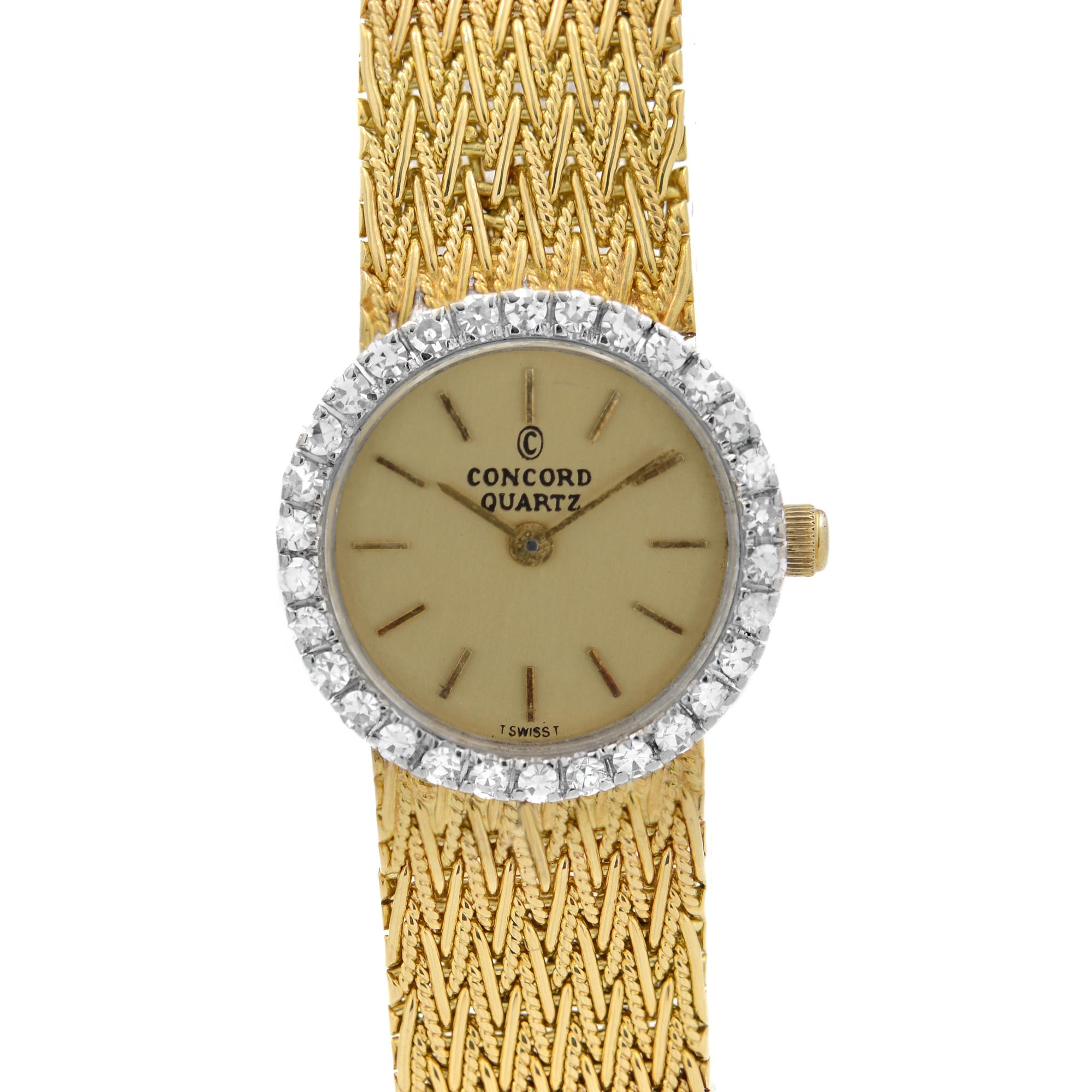 Pre Owned Concord 18K Yellow & White Gold Factory Diamond Bezel Quartz Ladies Watch 5161253. This Beautiful Timepiece is Powered by Quartz (Battery) Movement And Features: 18k Yellow Gold Case with an 18k Yellow Gold Mesh Bracelet that has a Jewelry