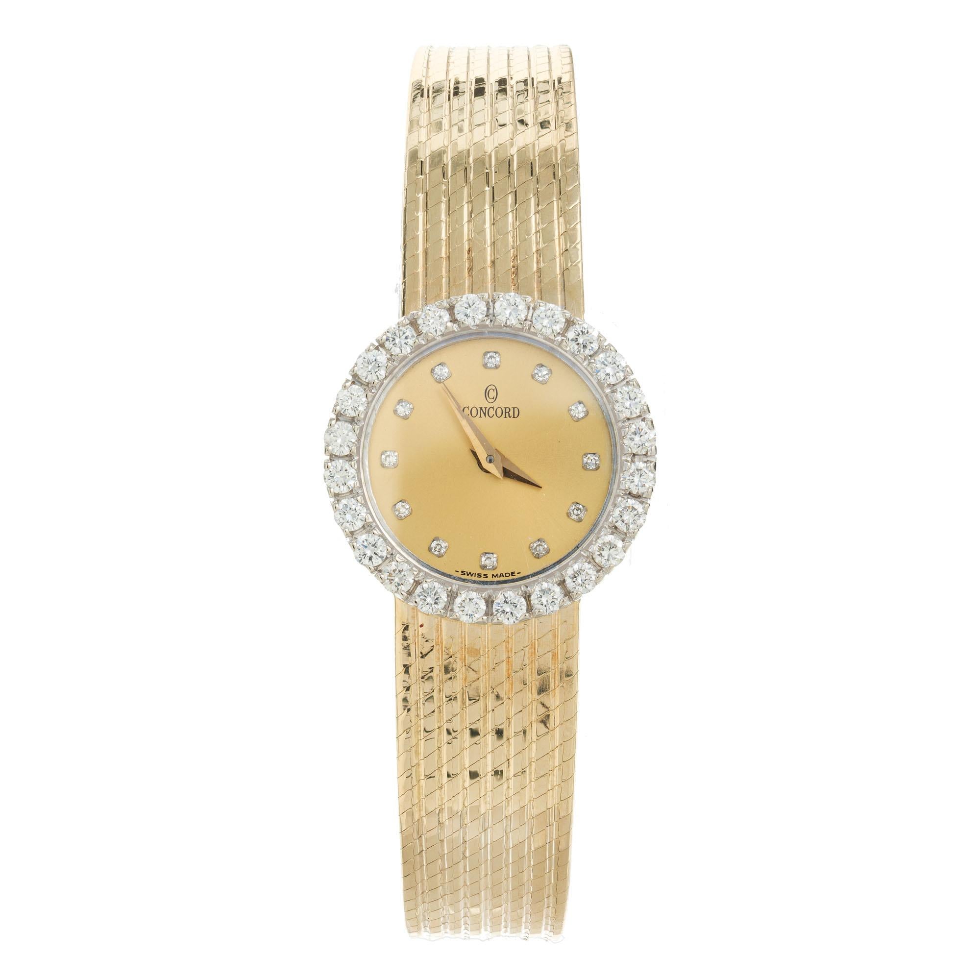 Ladies solid 14k gold Concord wristwatch with mesh band and quartz movement. 36 round cut diamond bezel. 6.75 length. 

36 round diamonds, G VS approx. .85cts 
14k yellow gold 
36.2 grams
Length: 21mm
Width: 21mm
Band width at case: 12mm
Case