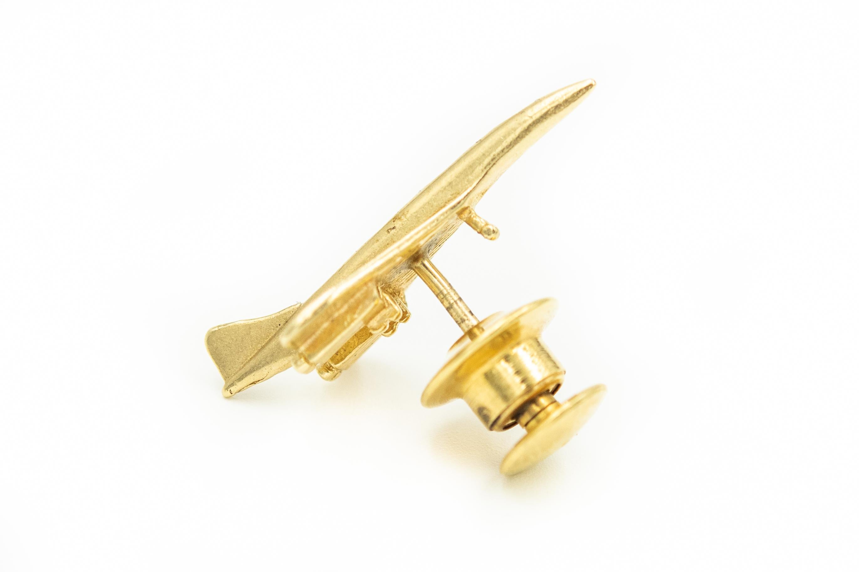 This would be a perfect gift for a pilot, traveler or airplane enthusiast. The pin is a 14k yellow gold concord plane with an etched design. The back fastener is gold plated.