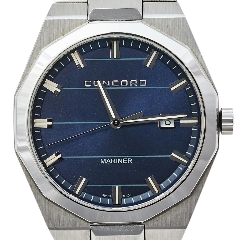 Exuding sophistication and class, this Concord Mariner watch personifies understated panache. Functioning on quartz movement, this timepiece comes with a stainless steel case that has a diameter of 41 mm. It has a blue striped dial that features
