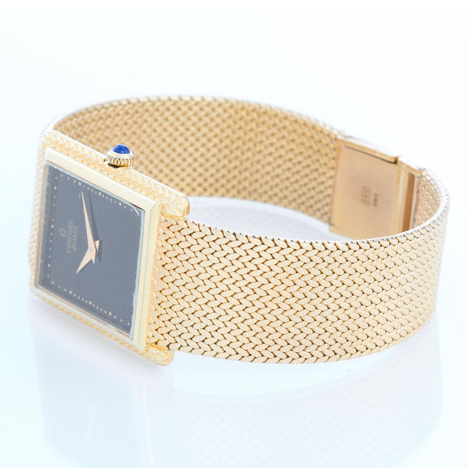 Concord Classique 14K  Yellow Gold Watch - Quartz. 14K Yellow Gold with smooth bezel  ( 24 mm x 32 mm ). Black dial with raised gold dots. 14K Yellow Gold Mesh bracelet. Will fit a 7 inch wrist. Pre-owned with Concord box and books .