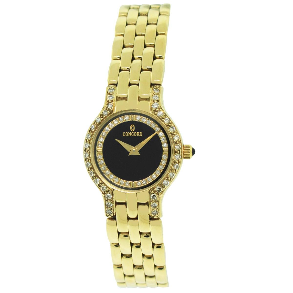 Brand: Concord
Model: Le Palais
Case Material: 14k Yellow Gold
Crystal: Sapphire crystal
Bezel: 18k Yellow Gold diamond bezel
Dial: Black dial with yellow gold hour hands.
Bracelet: Yellow gold link bracelet
Case Size: 21mm
Size: 6