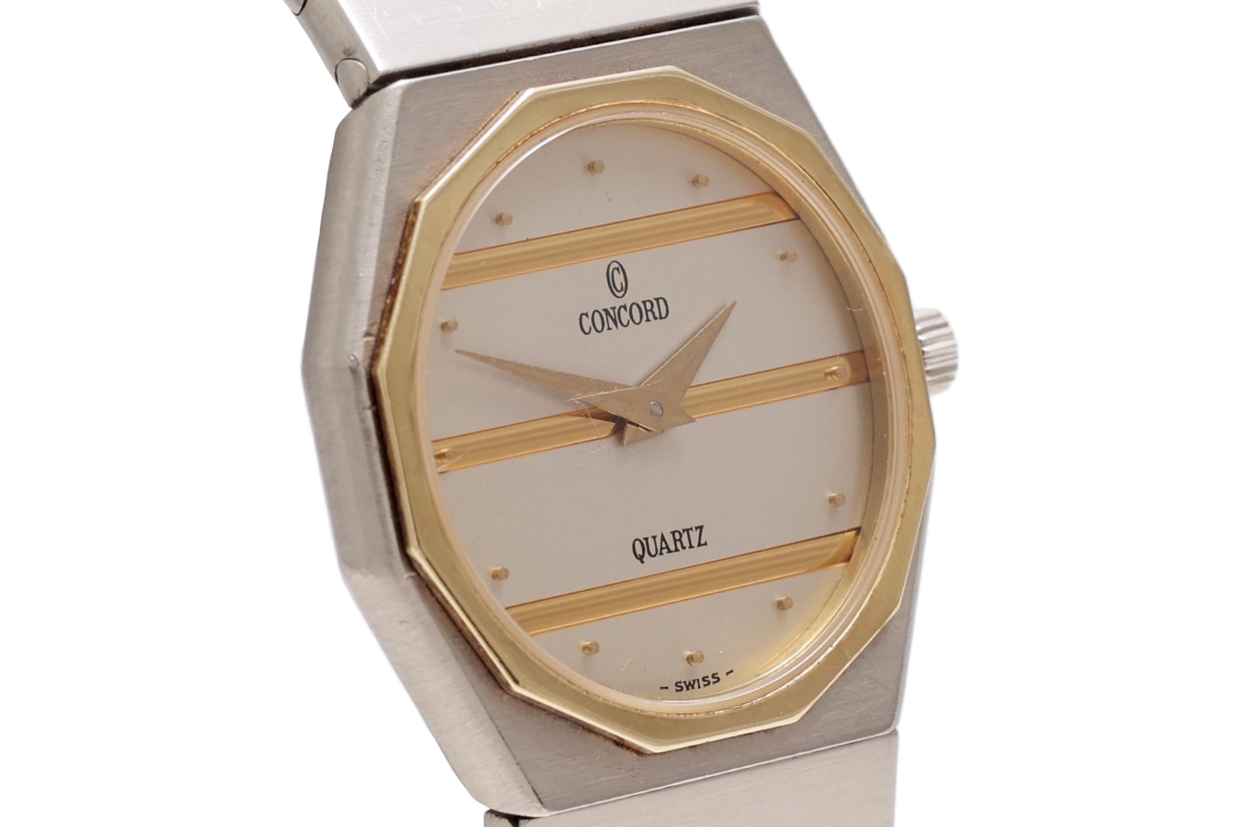 Concord Mariner Quartz Wristwatch, Steel and Gold, Diameter 23 mm

Functions: Hours, minutes

Movement: Quartz

Case: Gold & Steel case, Hexagon shape, diameter 23 mm, Sapphire crystal, 

Dial: Steel and gold 

Strap: Steel & Gold strap, Will max