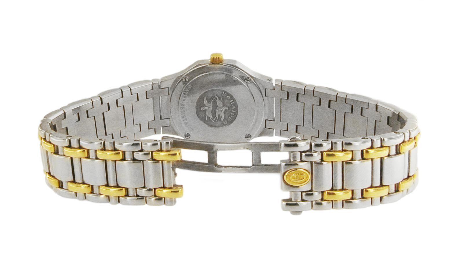 CONCORD SARATOGA 18K YELLOW & STEEL DIAMOND BEZEL WATCH 15 73 287

-Mint condition
-Case size: 23mm
-Case thickness: 6mm
-Movement: Quartz
-18k Yellow Gold & Stainless steel
-Roman Numeral dial
-Cream dial

*Comes with box, no papers.
Retail: $6,660