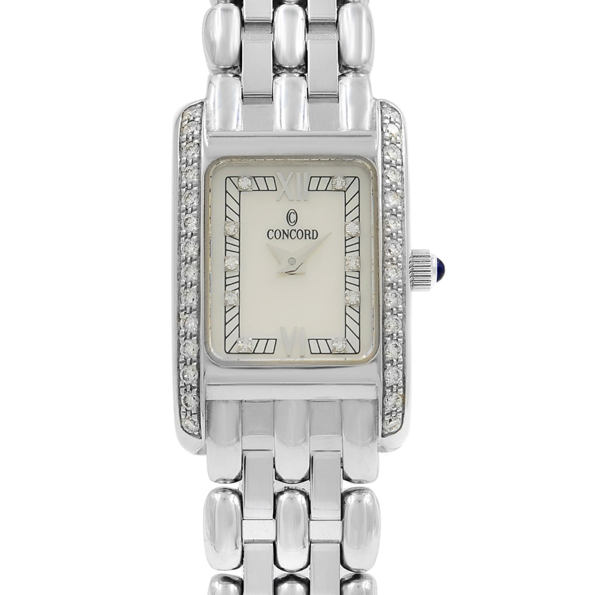 This pre-owned Concord Veneto 61-25-680 is a beautiful Ladies timepiece that is powered by a quartz movement which is cased in a white gold case. It has a rectangle shape face, diamonds dial, and has hand diamonds style markers. The case size